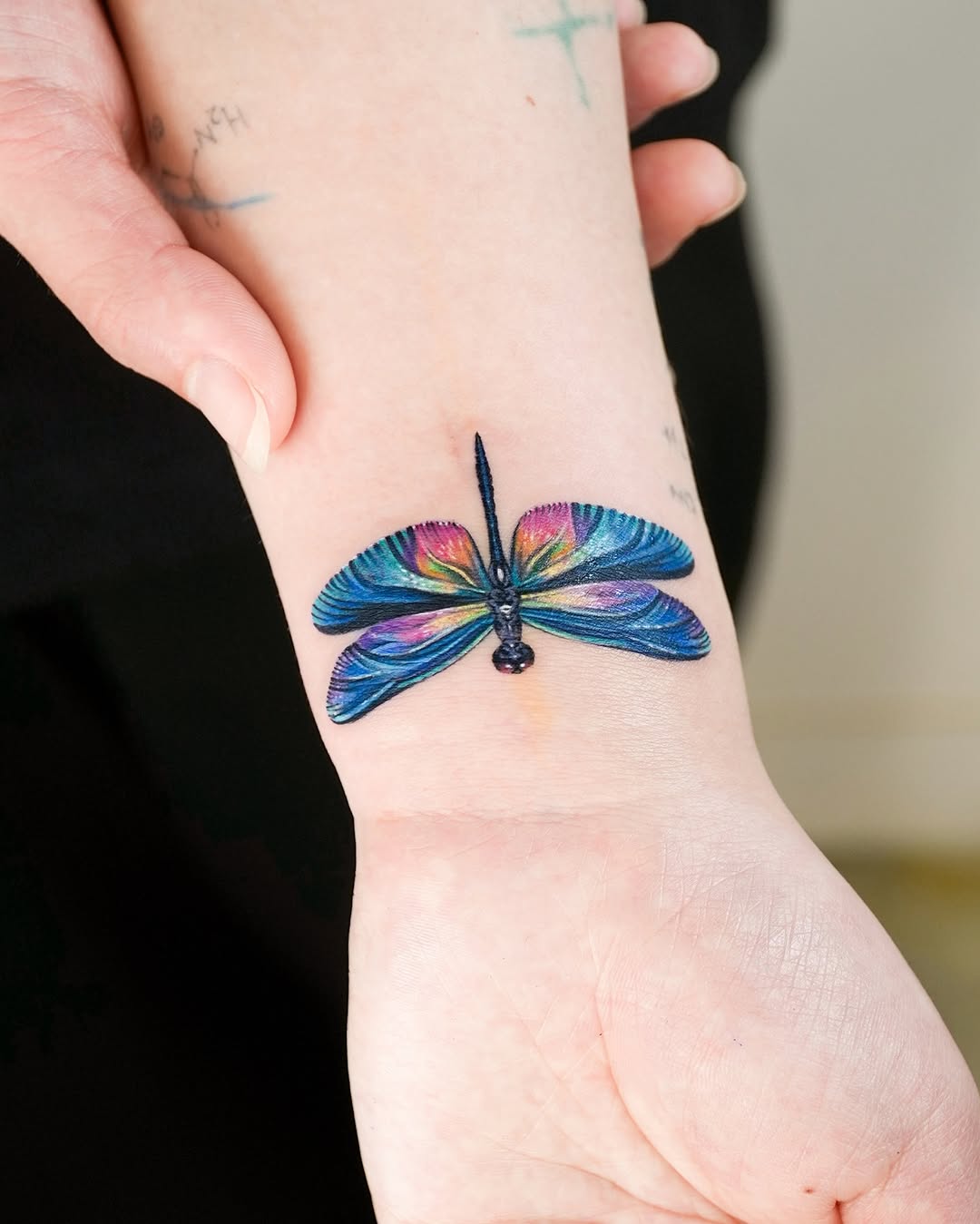 Vibrant butterfly tattoo gracing the arm