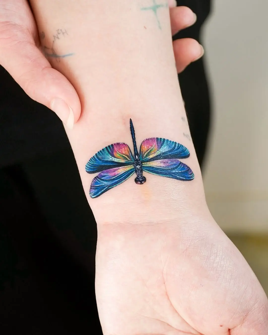 Vibrant butterfly tattoo gracing the arm