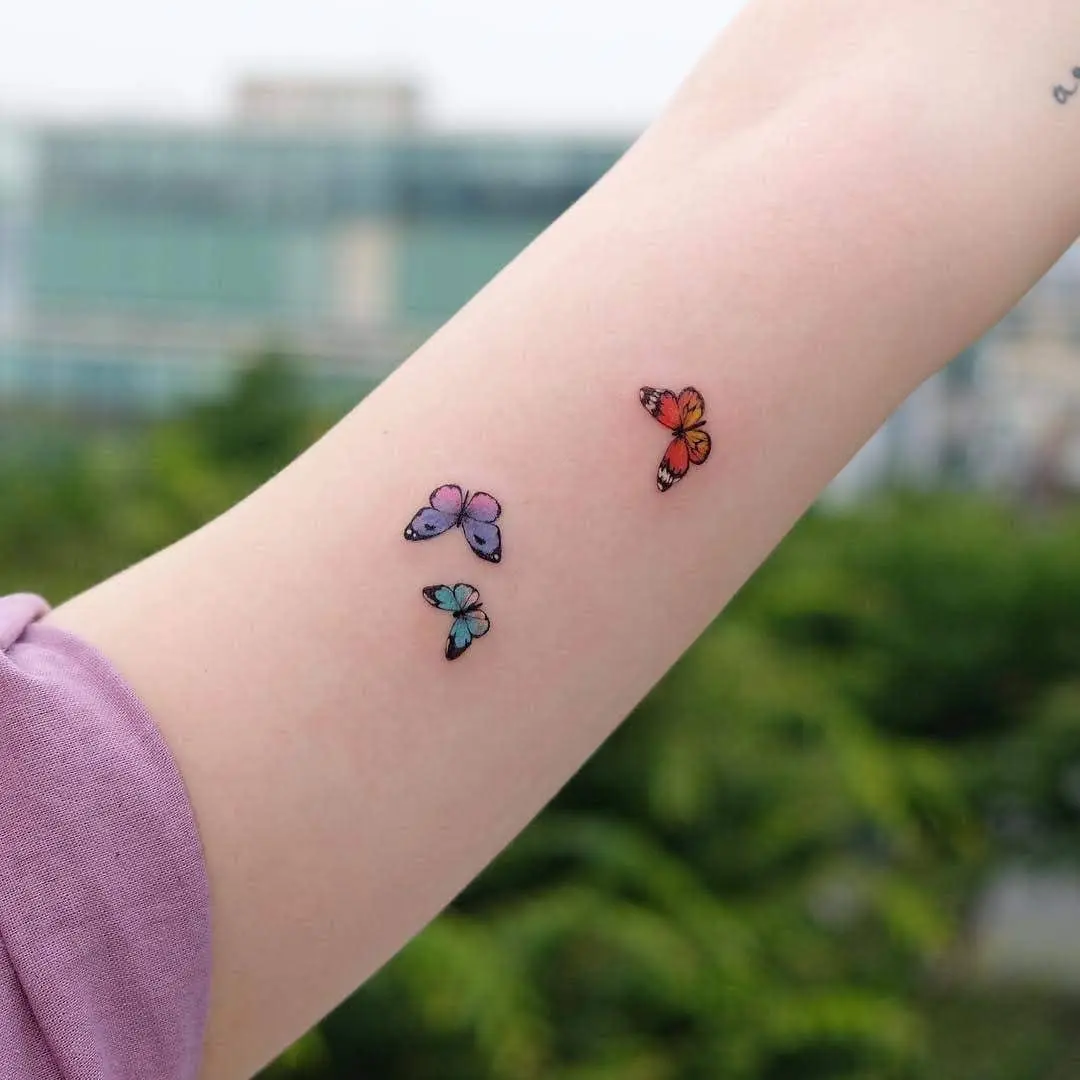 Vibrant butterfly tattoos on display