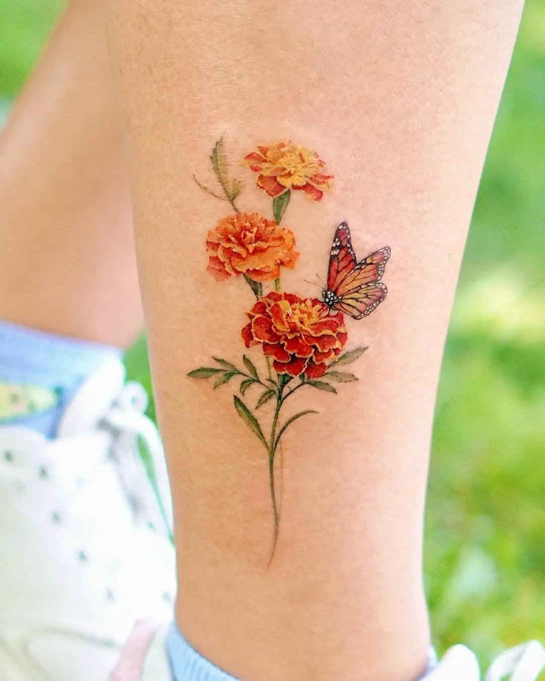 Vibrant butterfly and flower tattoo design