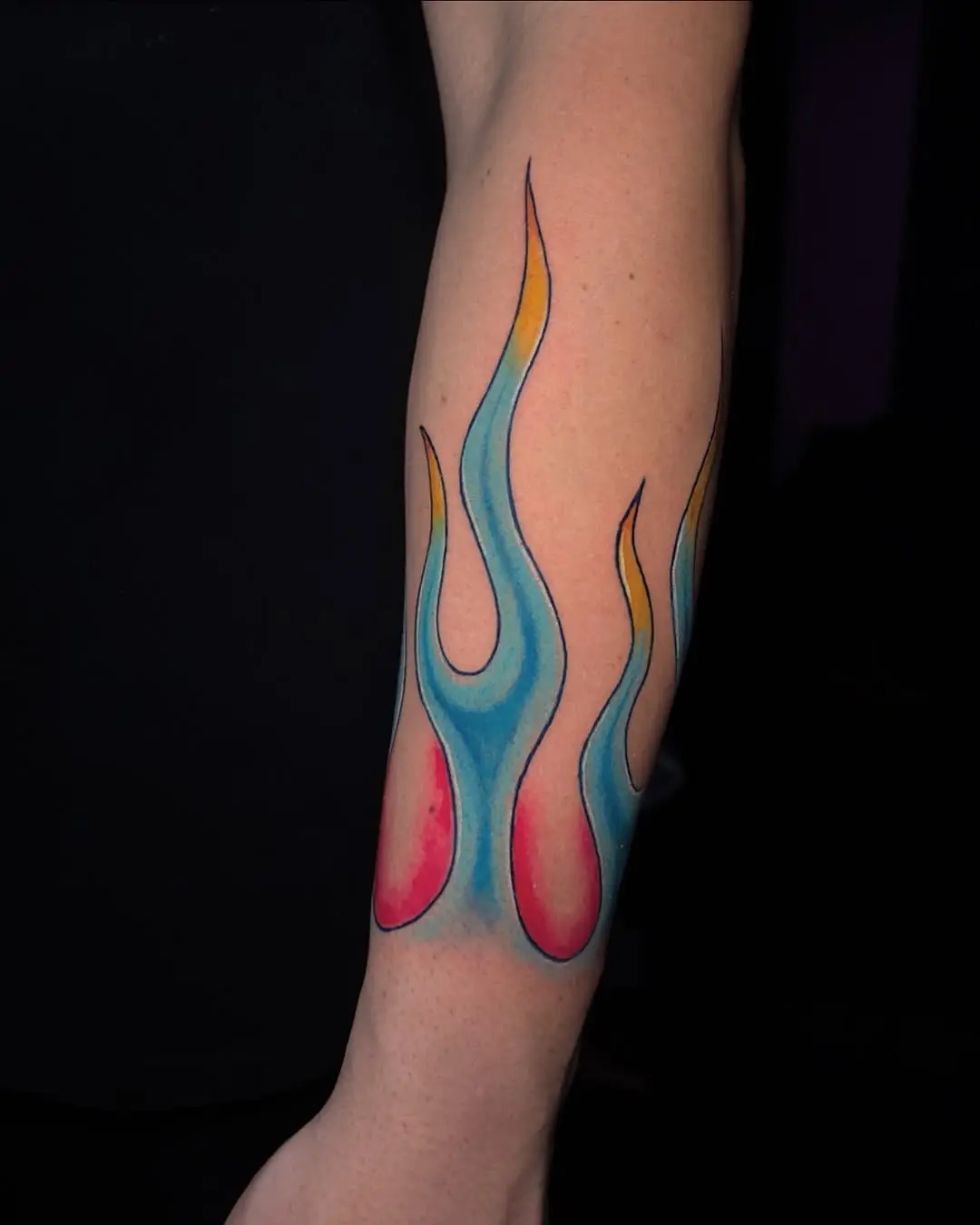 Vibrant flames showcasing colorful tattoo artistry