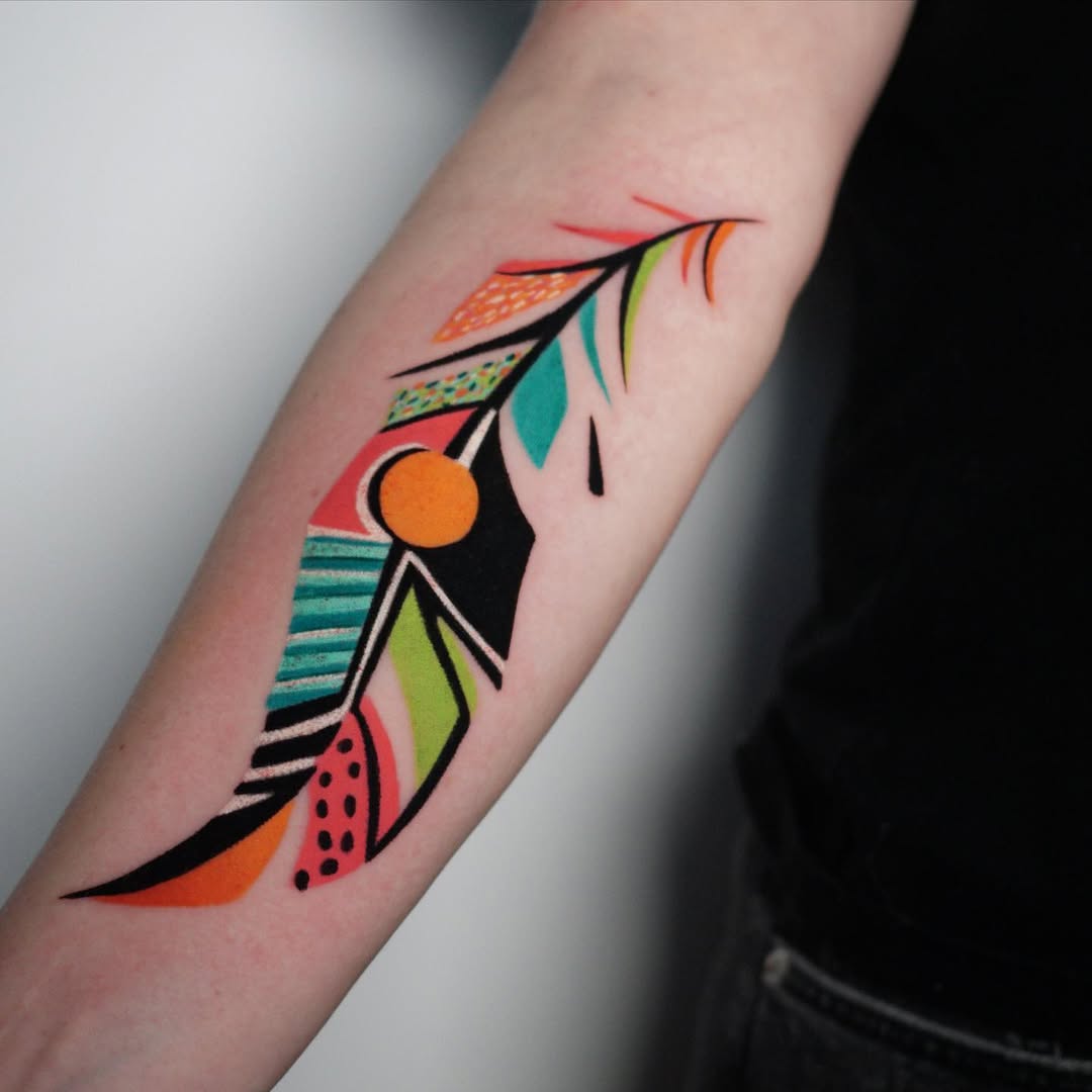 Vibrant and Artistic Feather Tattoo Design