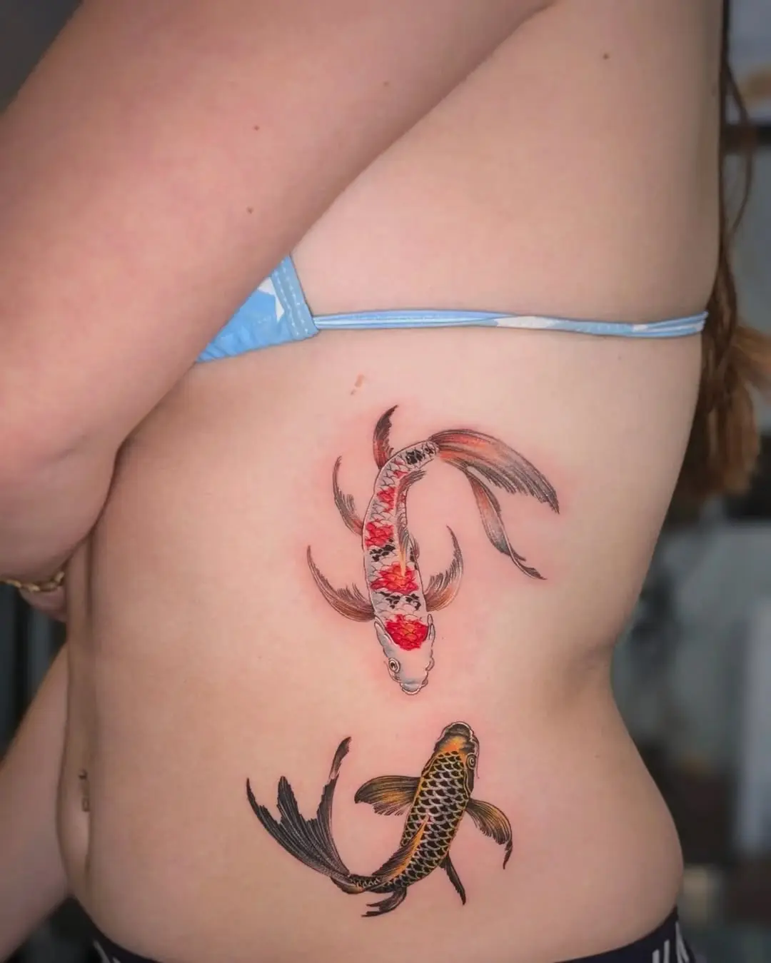 Elegant koi fish tattoos swirling together.