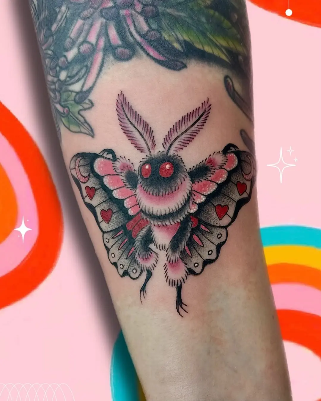 Vibrant moth tattoo with playful elements