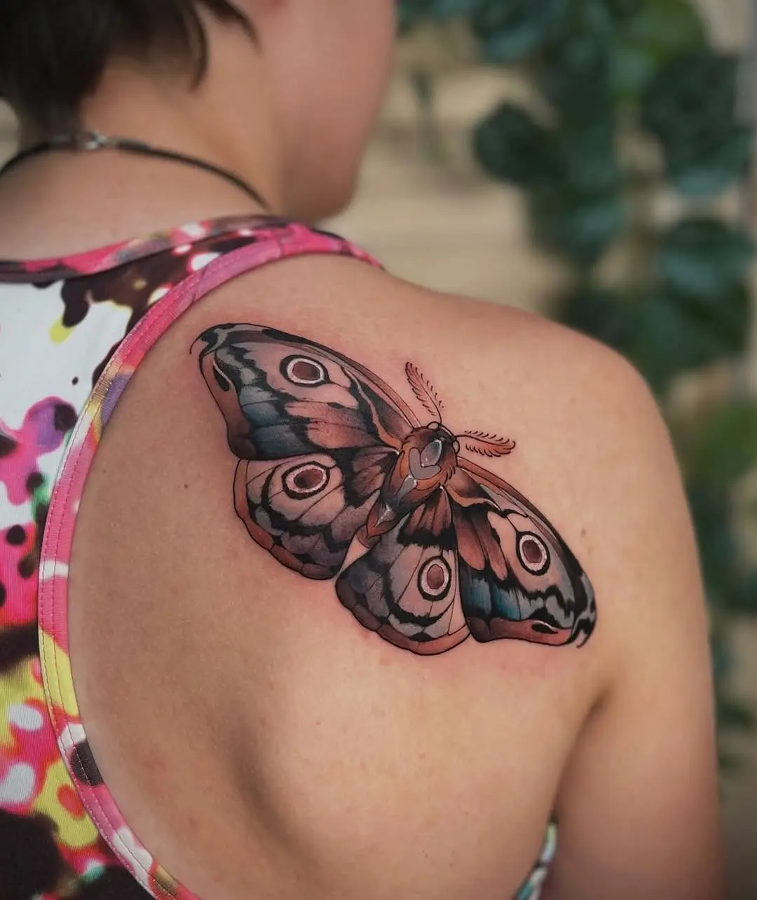 Stunning realistic moth tattoo on the back