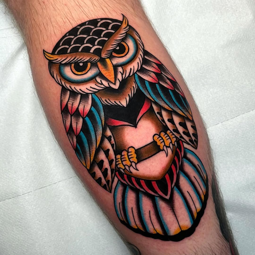 Vibrantly colored owl tattoo with unique design