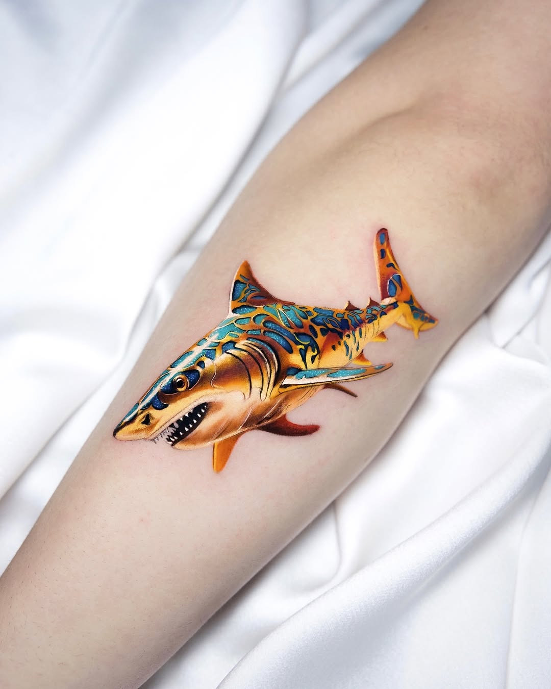 Vibrant shark tattoo with intricate details