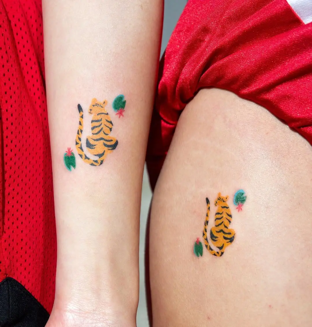 Dynamic tiger tattoos with vibrant detailing