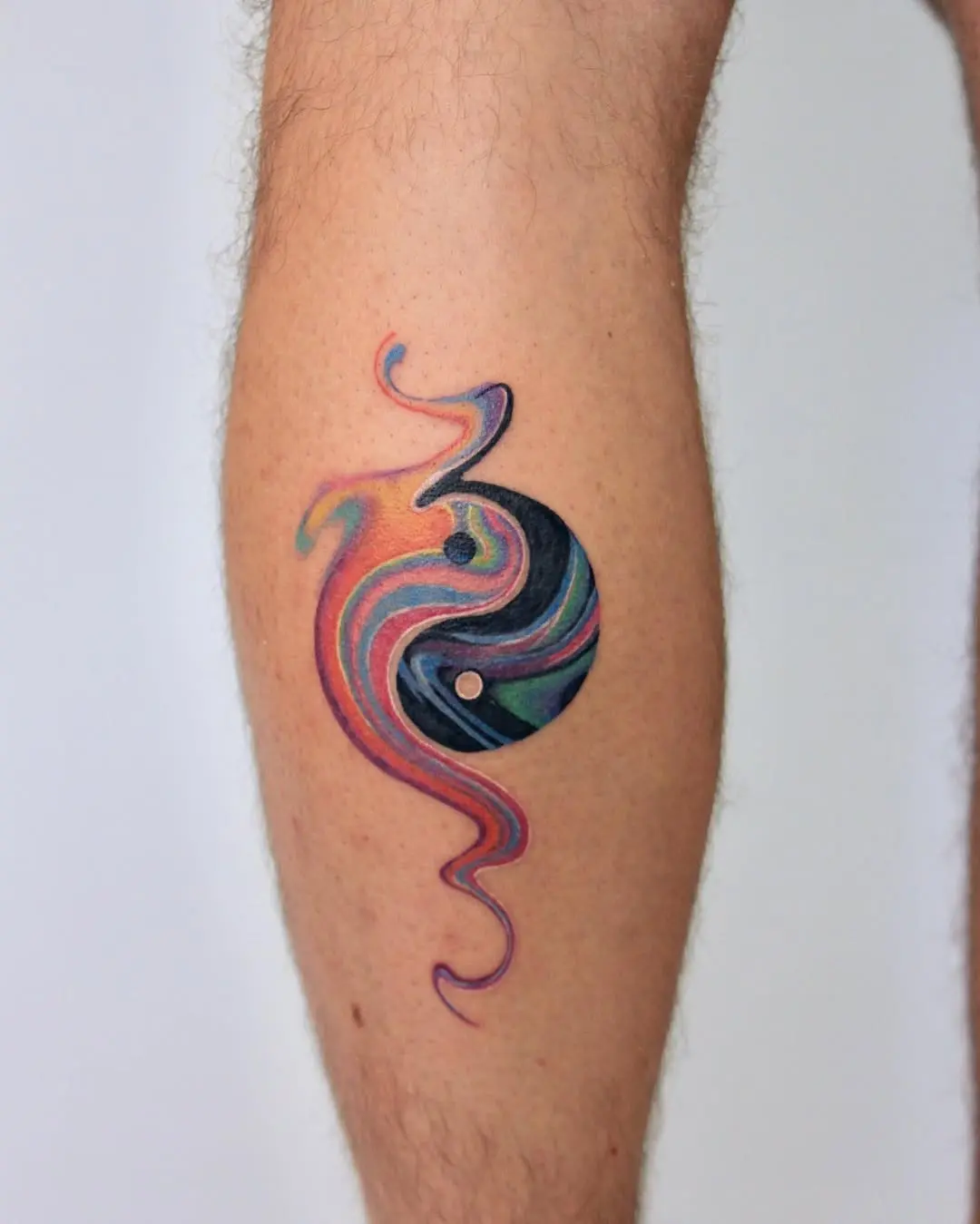 Artistic yin yang tattoo with colorful swirls