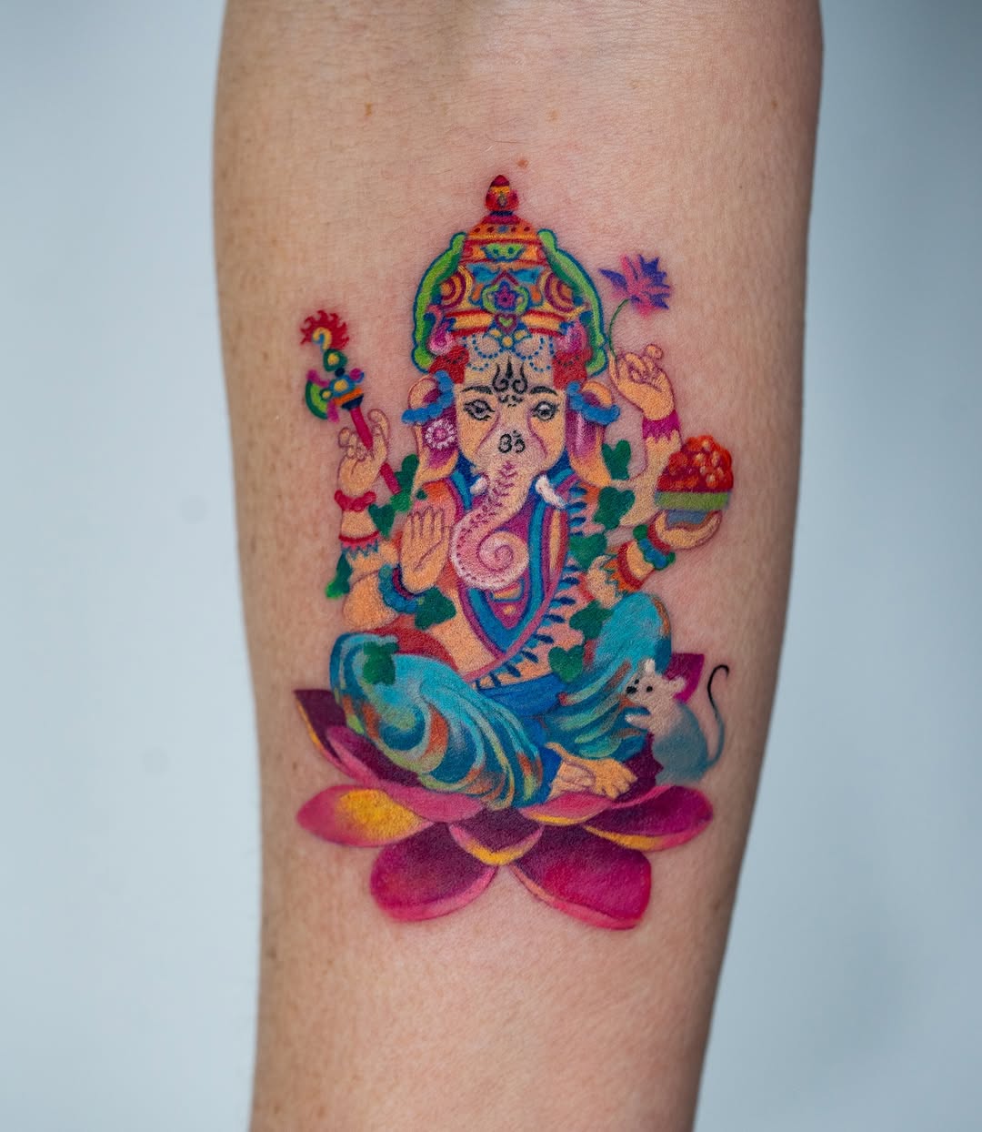 Colorful Ganesha tattoo symbolizing abundance