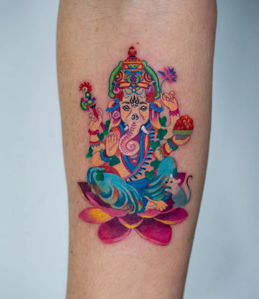 Colorful Ganesha tattoo symbolizing abundance