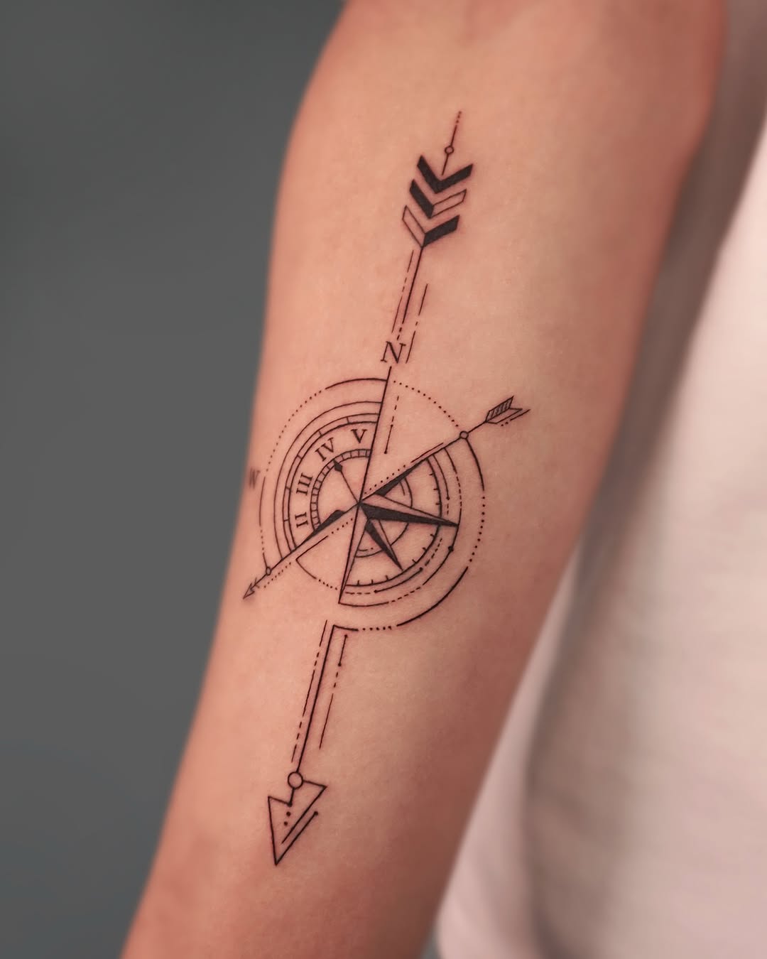 Stylish compass tattoo with arrow details