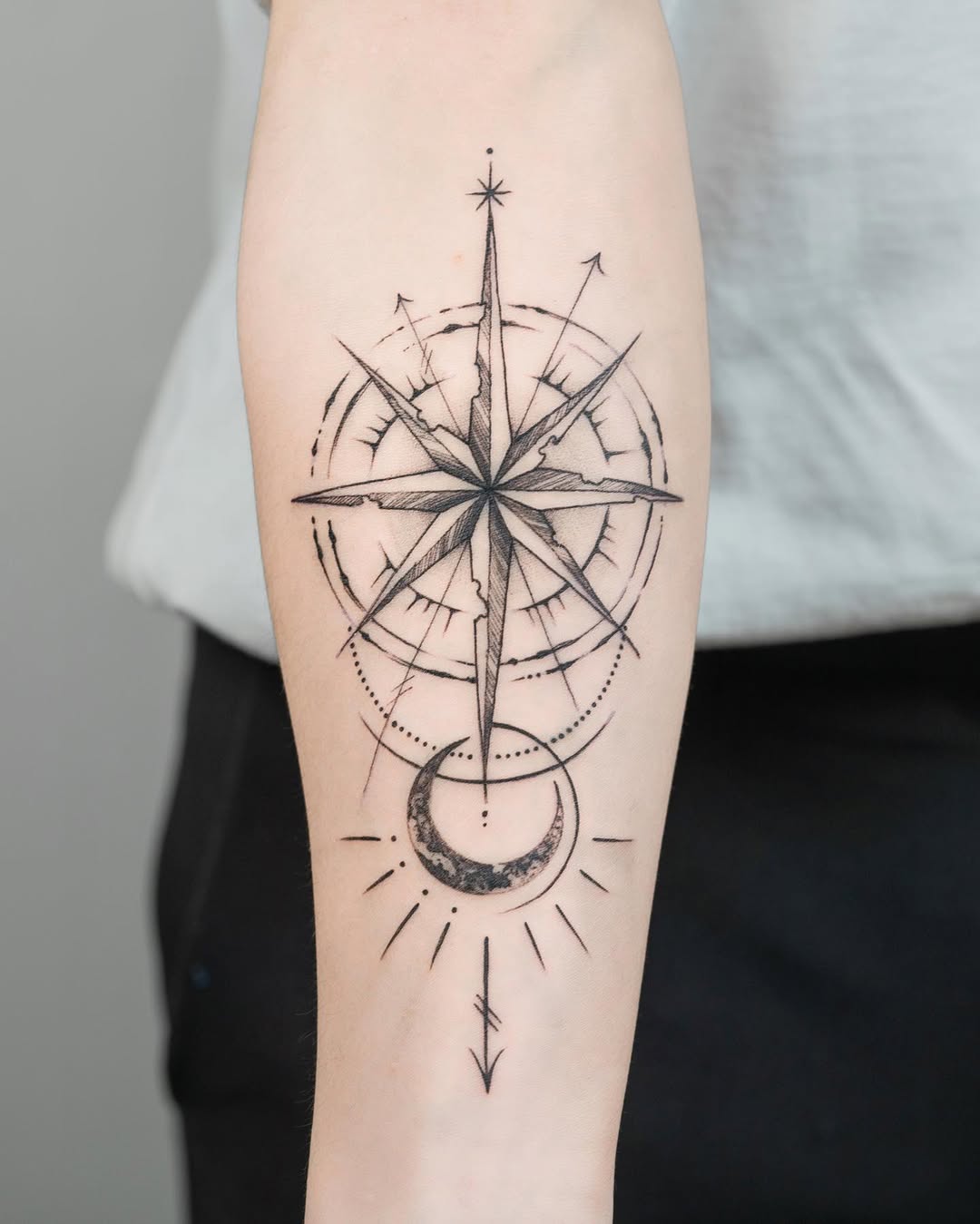 Stylish compass tattoo with moon accents