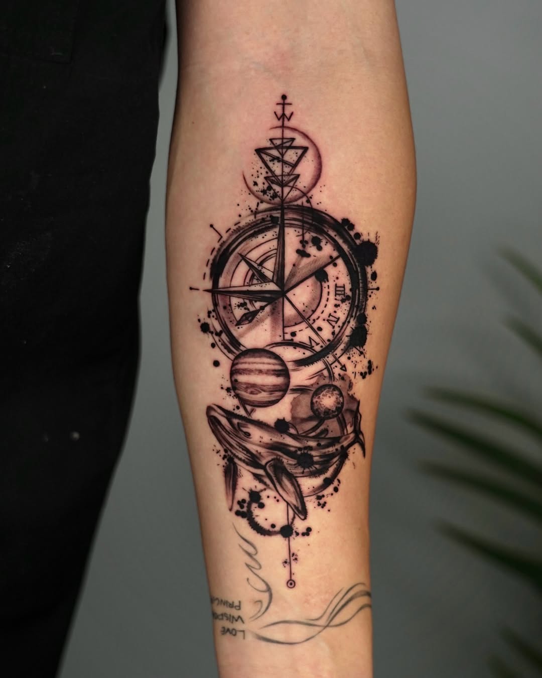 Stunning compass tattoo blending space elements beautifully