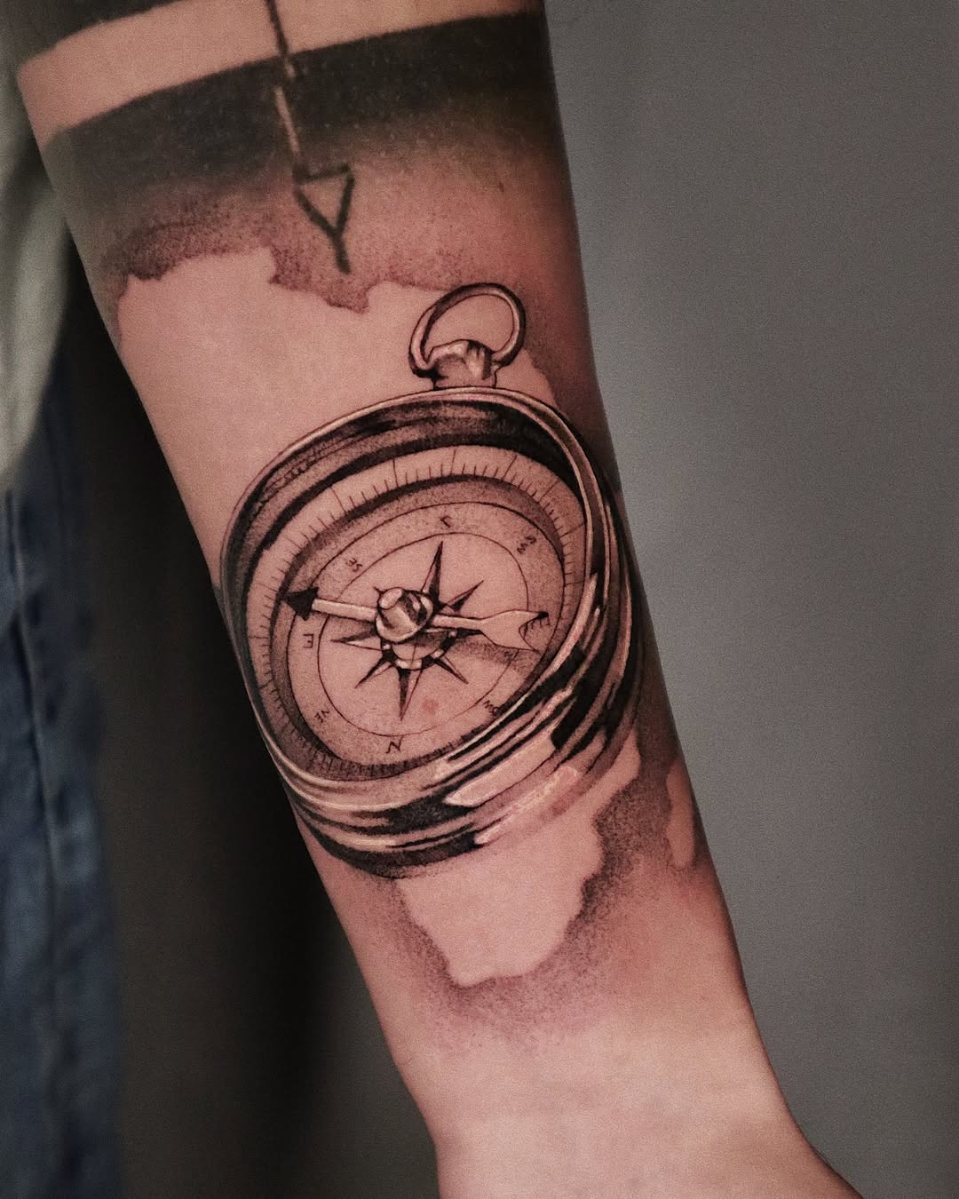 Intricate compass tattoo on forearm adornment