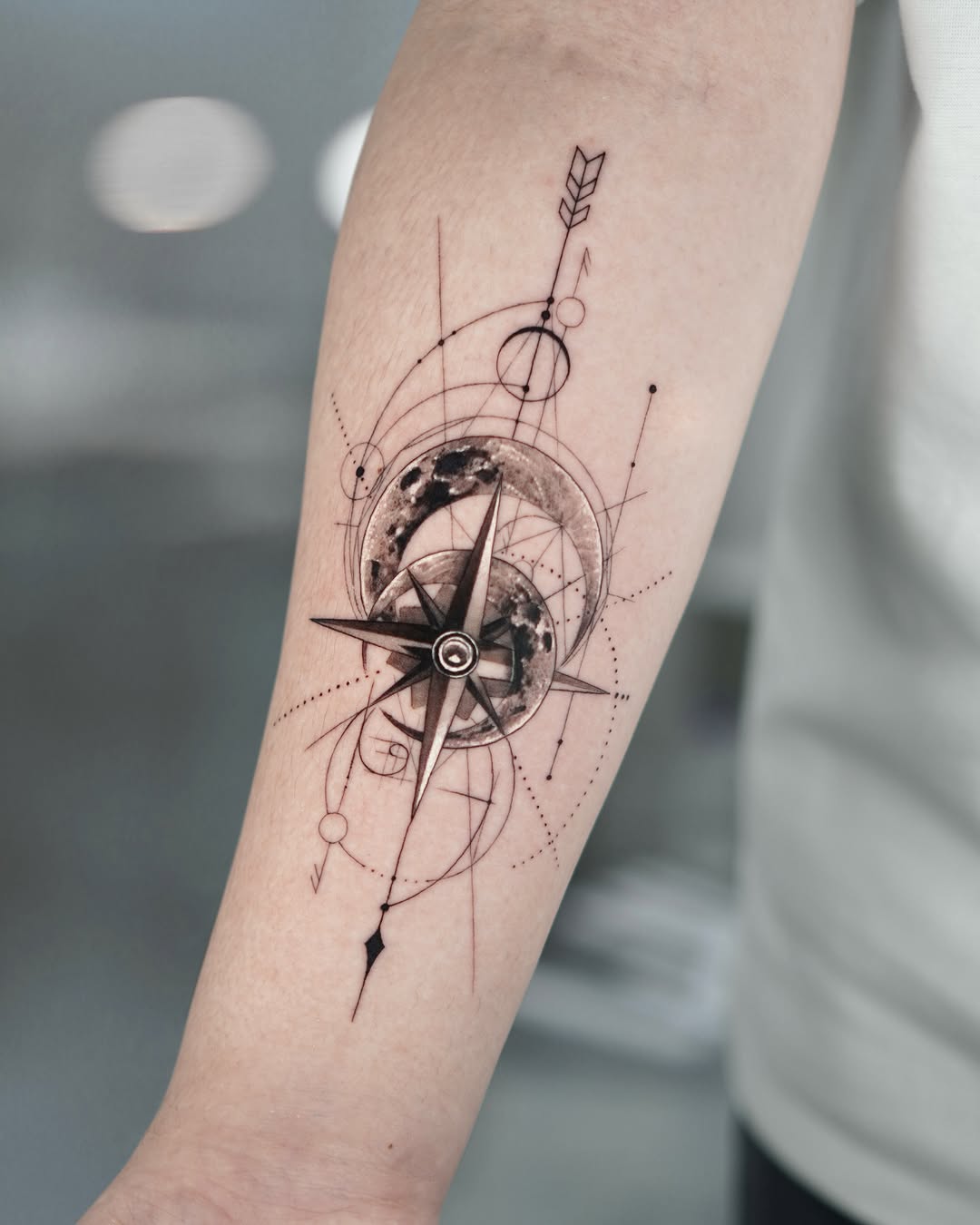 Stylish compass tattoo with geometric elements