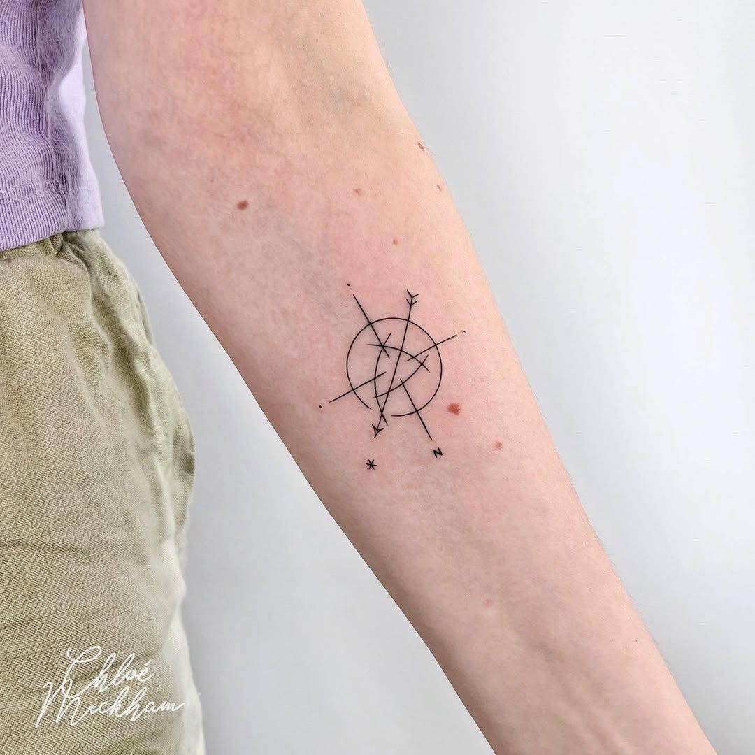 Minimalist compass tattoo with elegant linework