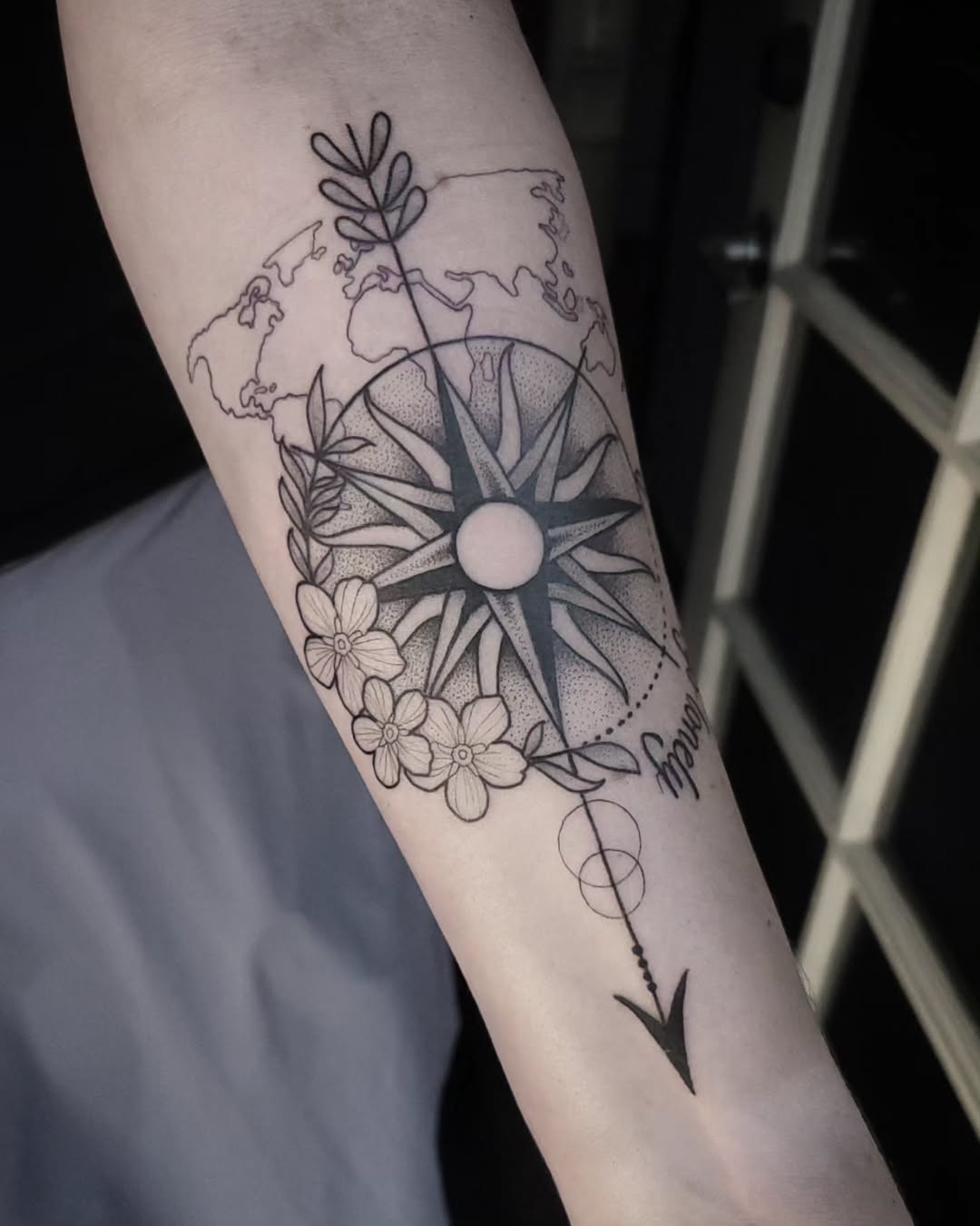 Stylish compass tattoo with floral elements