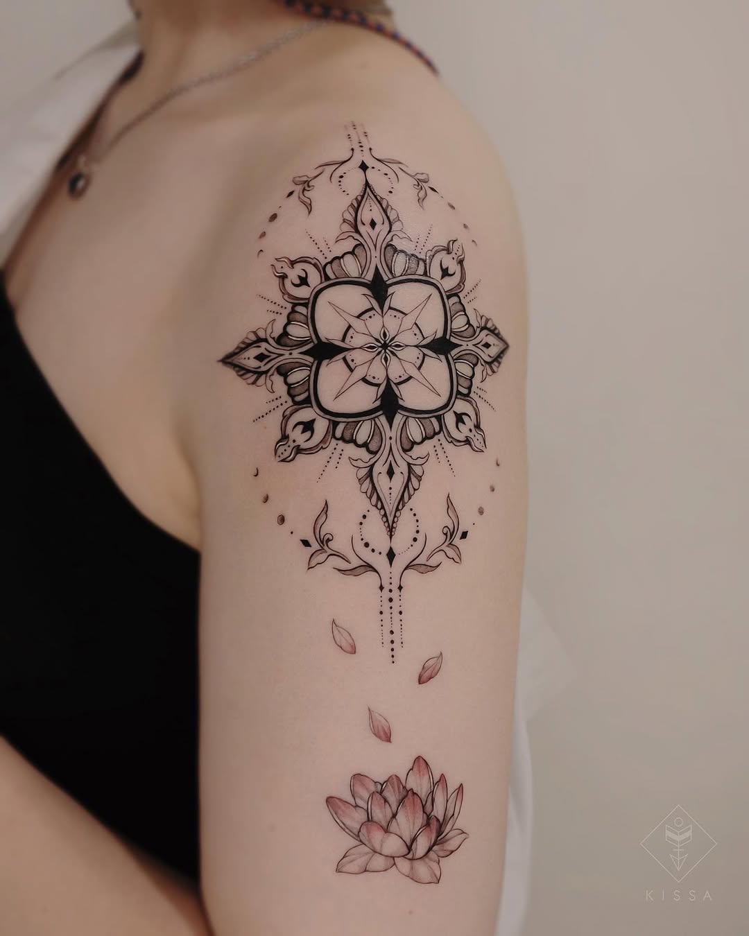 Elegant compass tattoo with a lotus flower