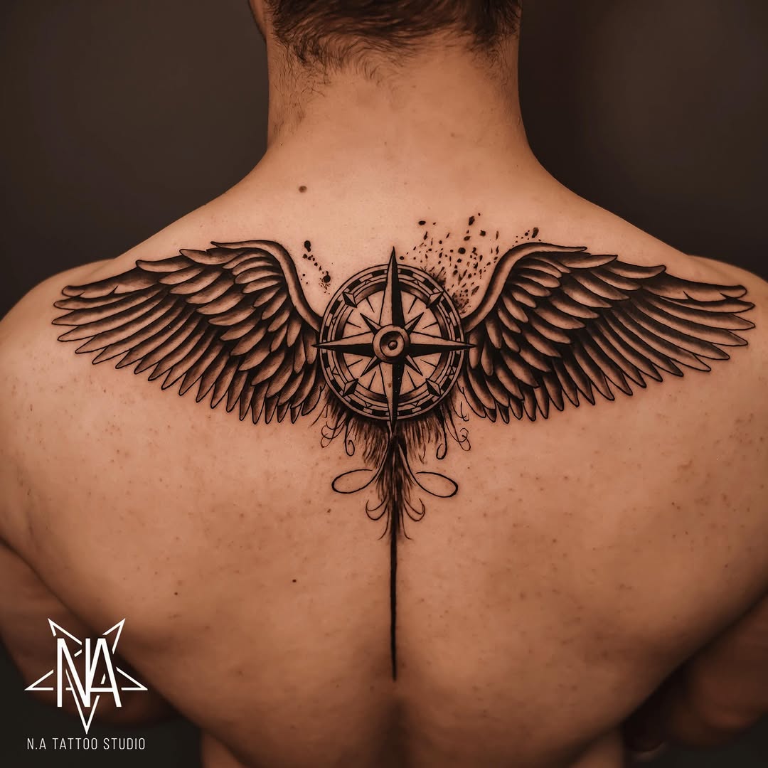 Stunning winged compass tattoo on the back