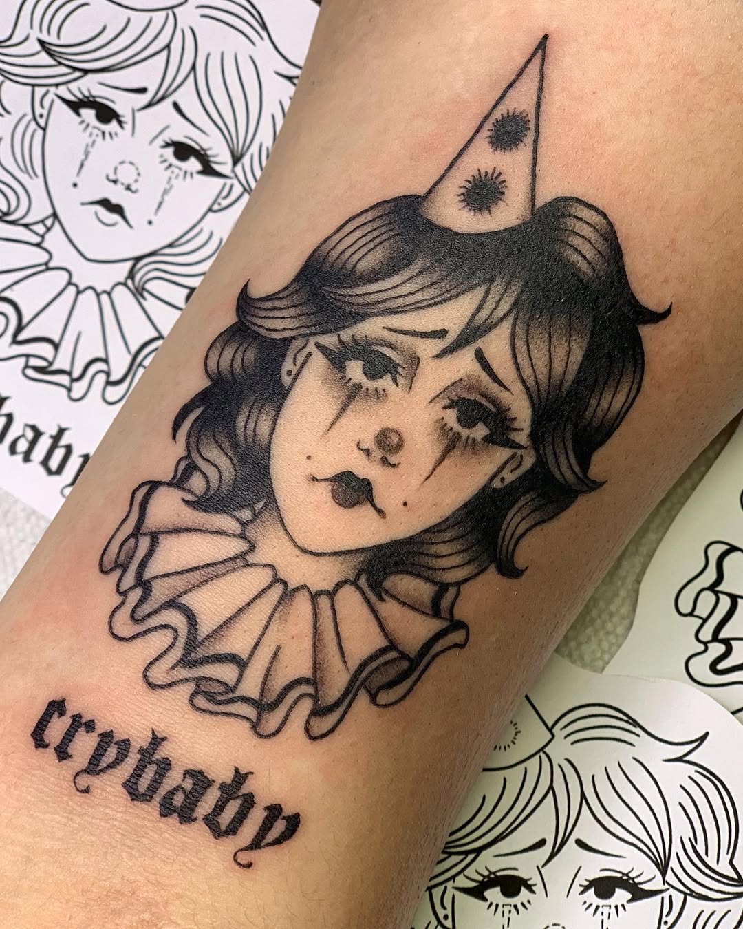 Melancholic clown tattoo showcases raw emotion