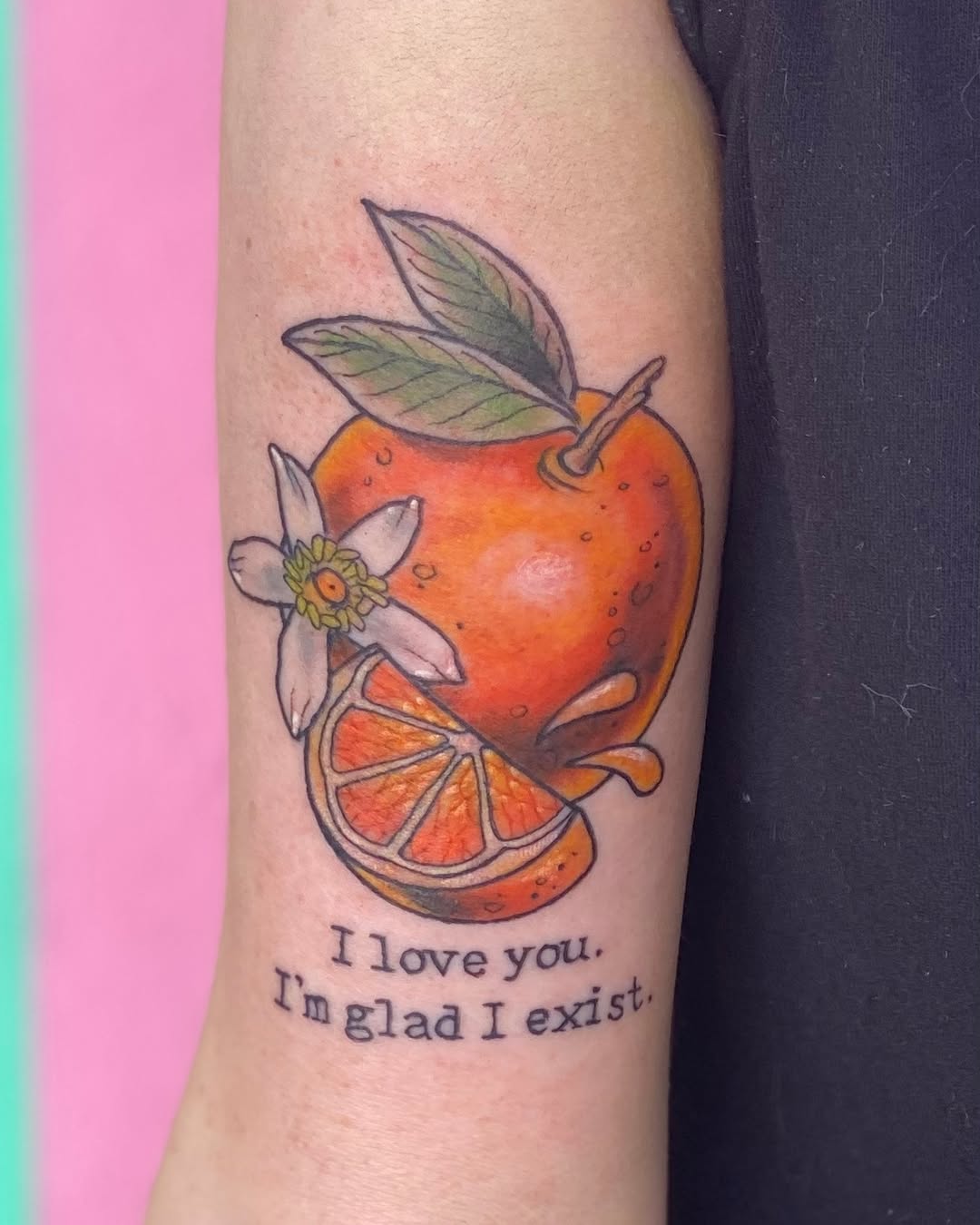 Vibrant orange tattoo with a heartfelt message