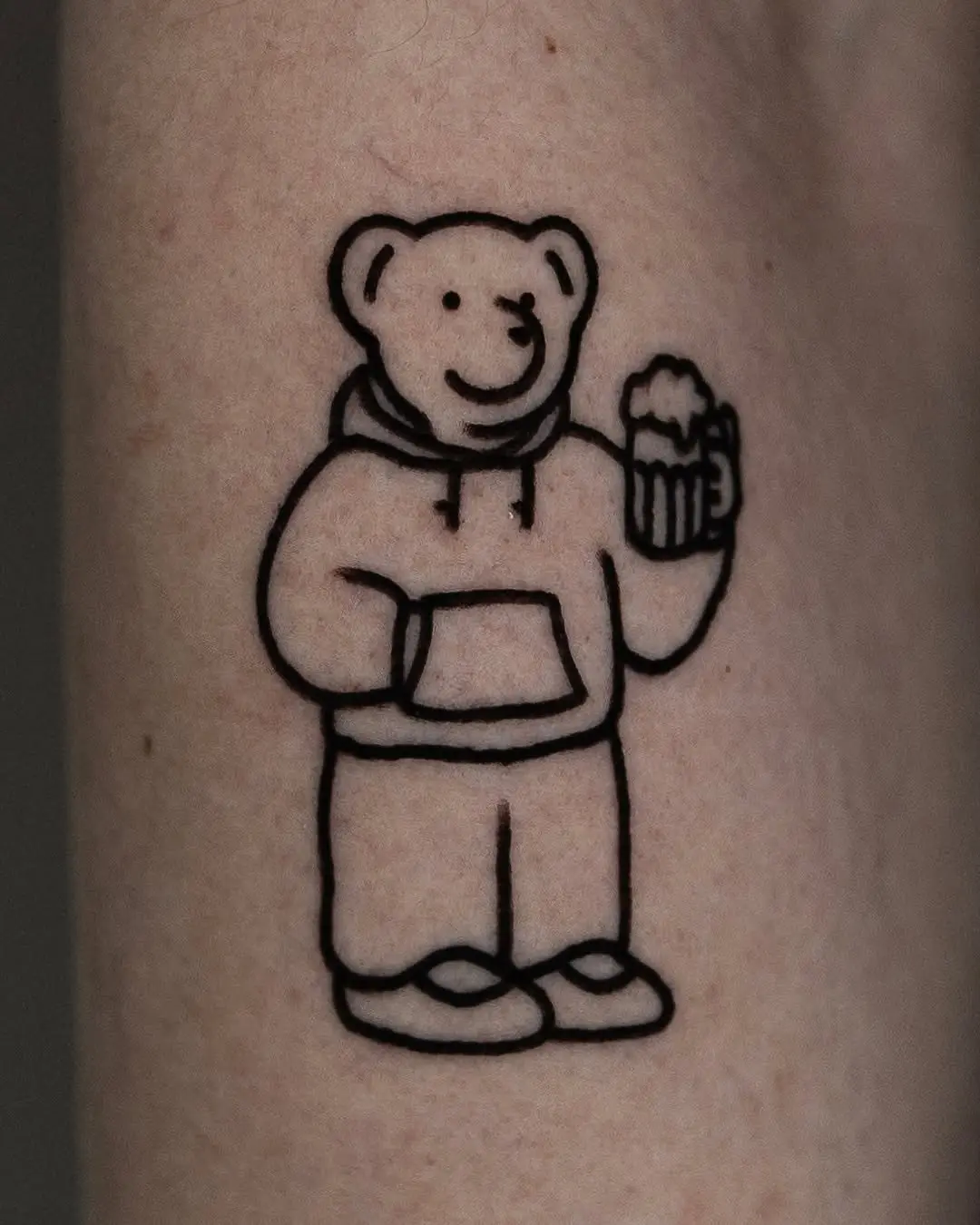 Adorable bear tattoo with a fun vibe