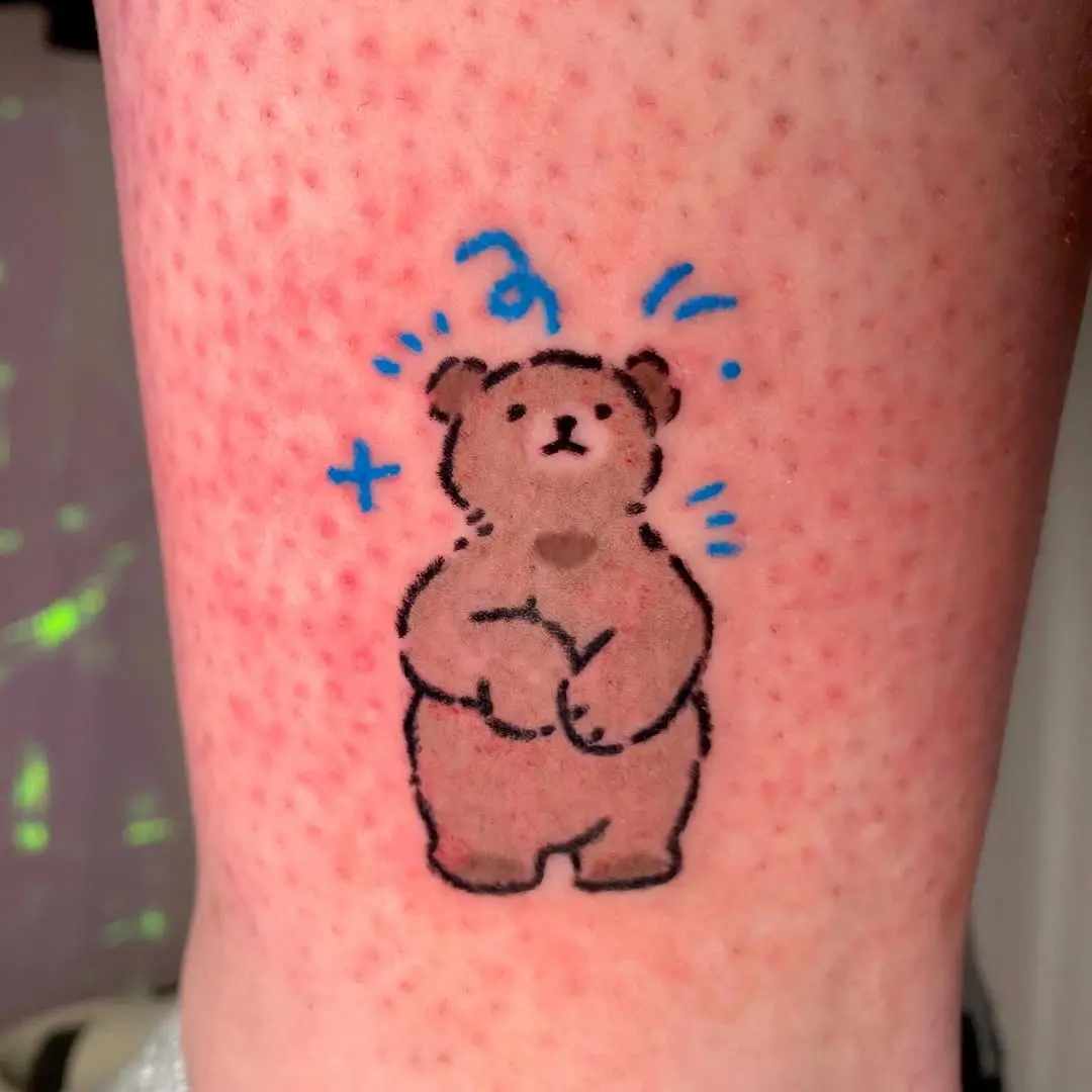 Adorable bear tattoo with a playful vibe