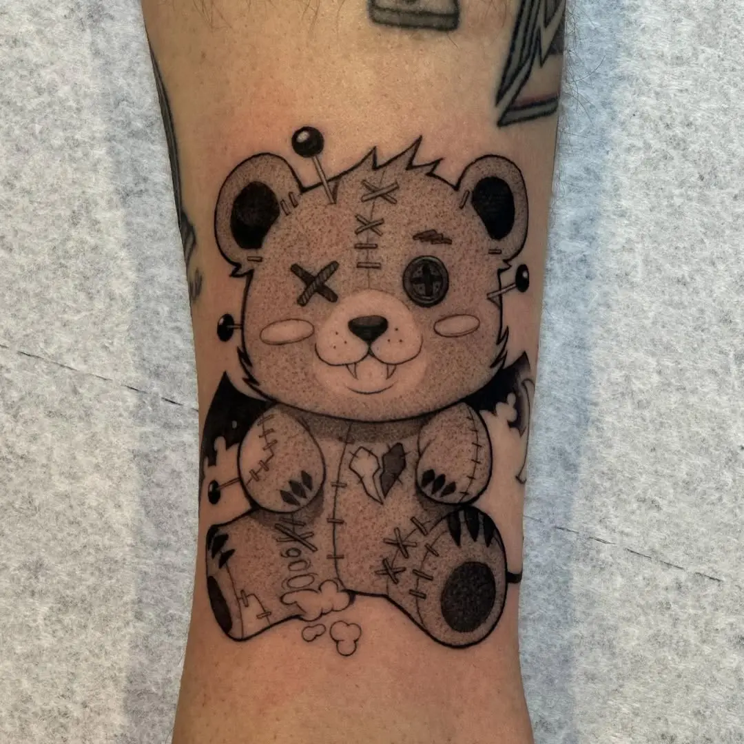Adorable stitched bear tattoo with a quirky vibe