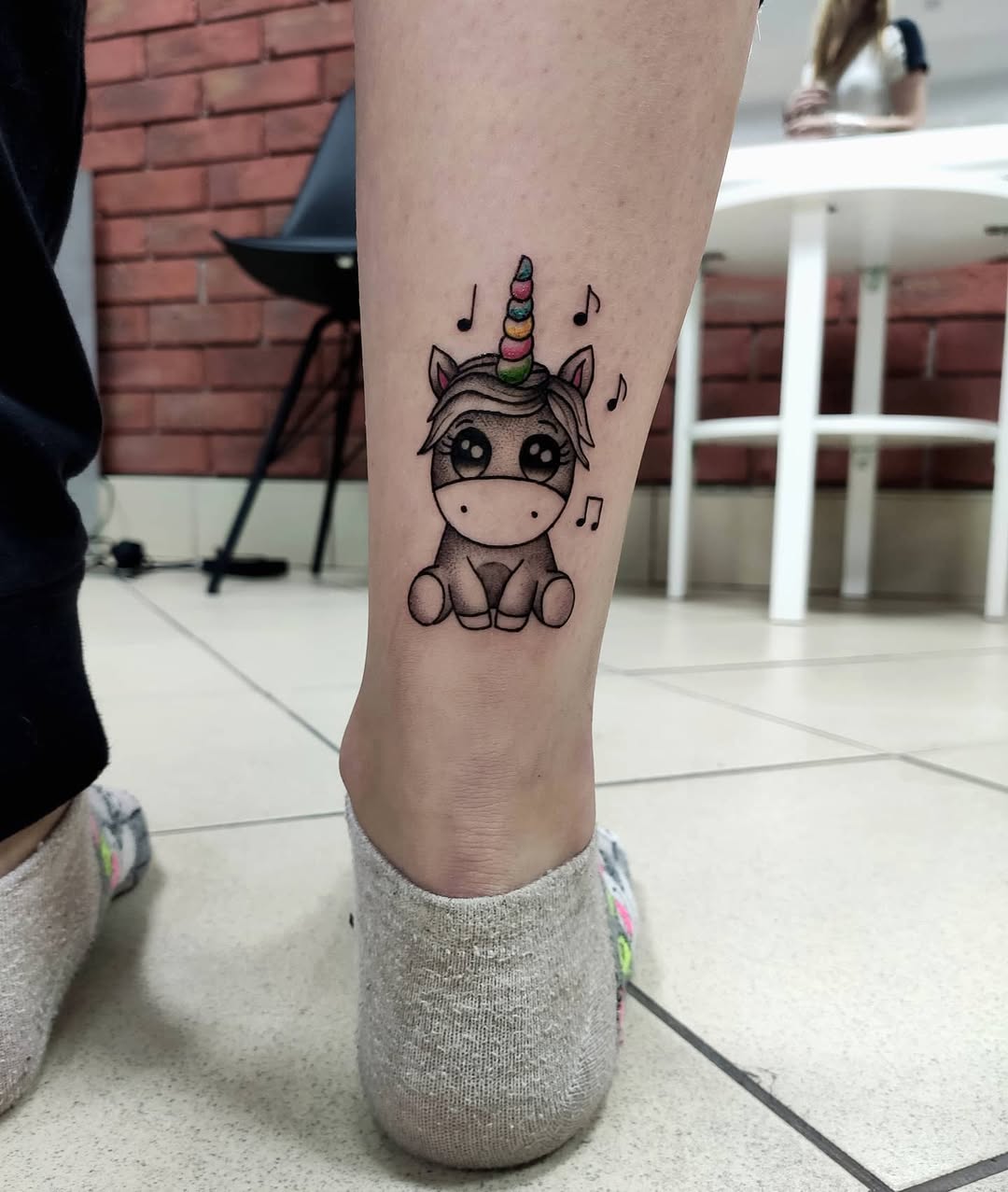 Adorable Unicorn Tattoo with Musical Notes