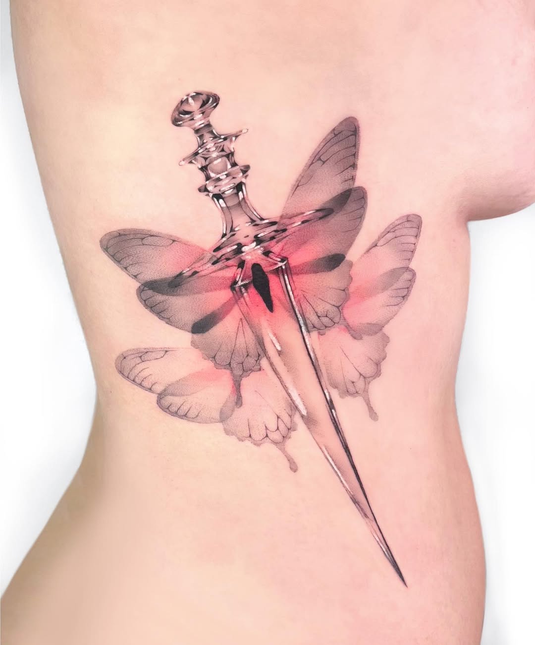 Intricate dagger and butterfly tattoo concept