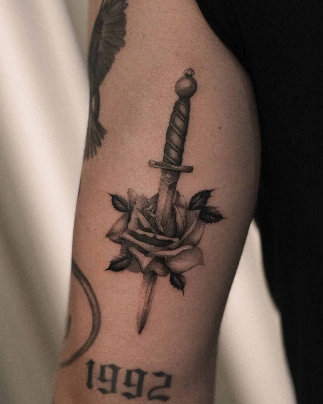 Bold dagger and rose tattoo design