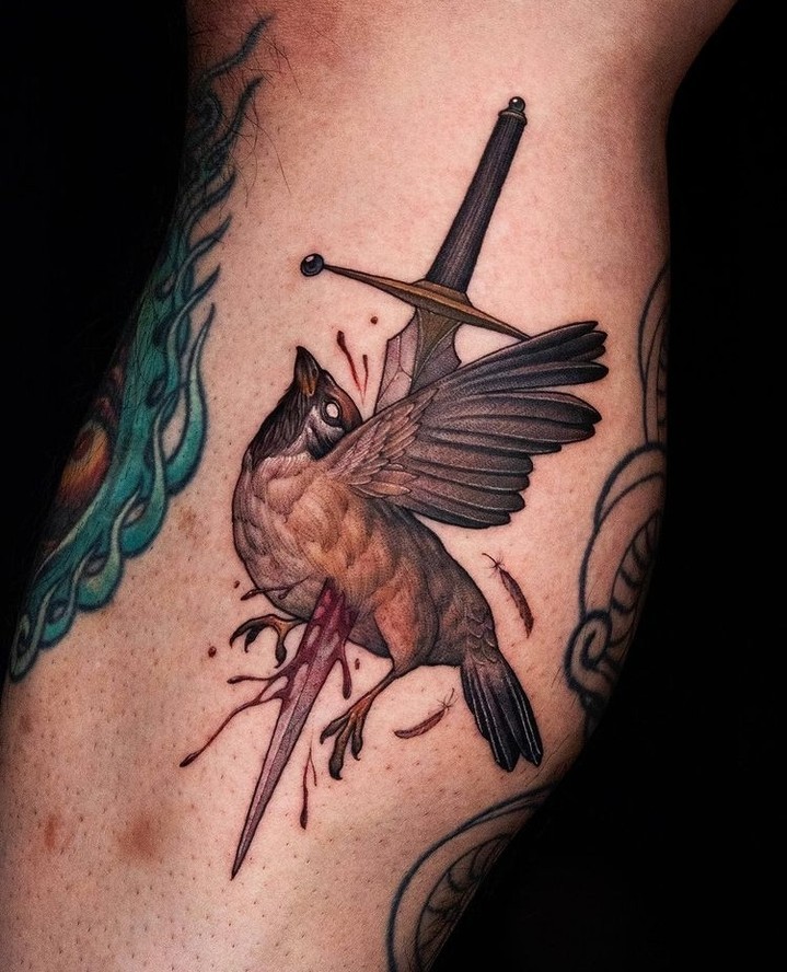 Beautiful blend of nature and weaponry tattoo