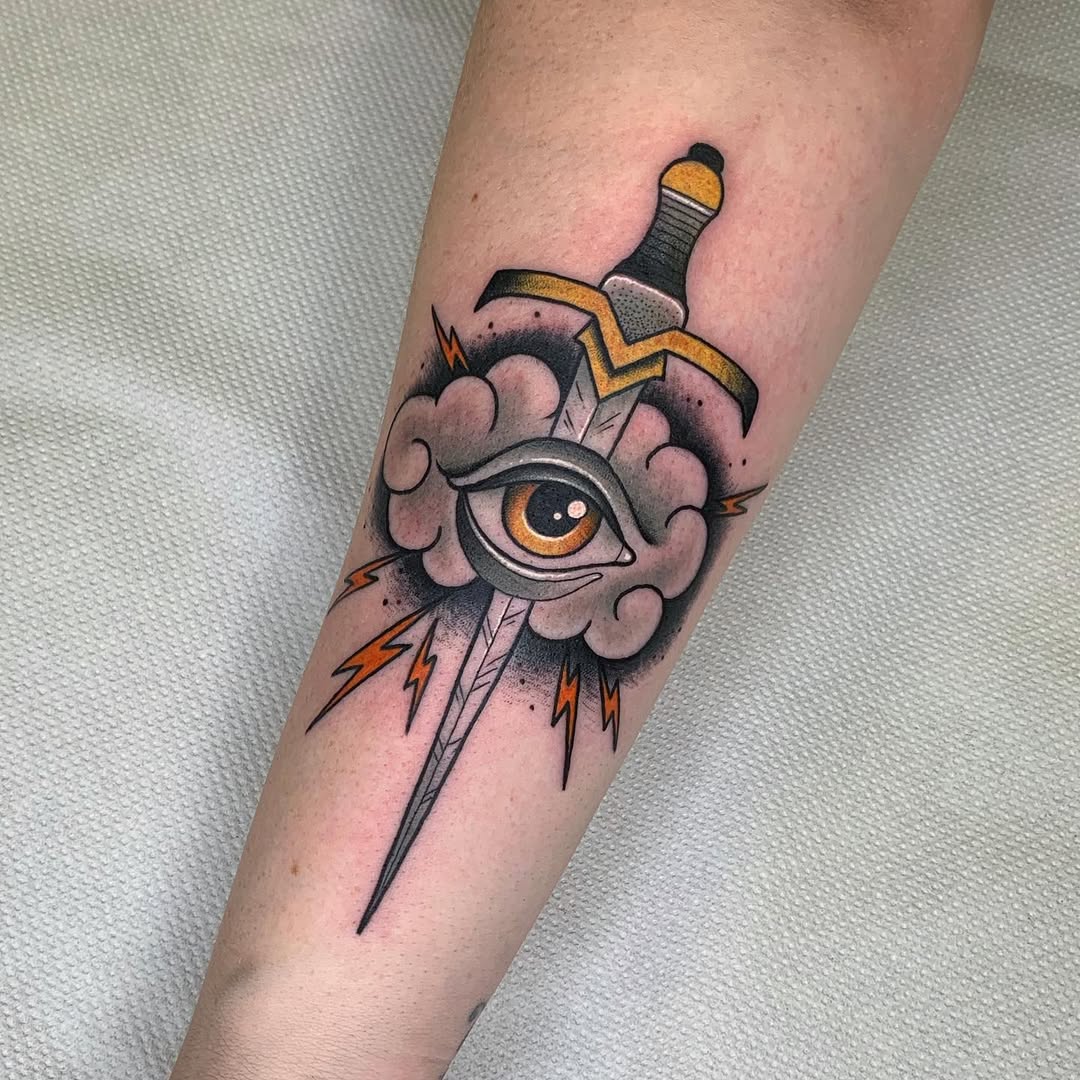 Symbolic dagger tattoo with an eye design