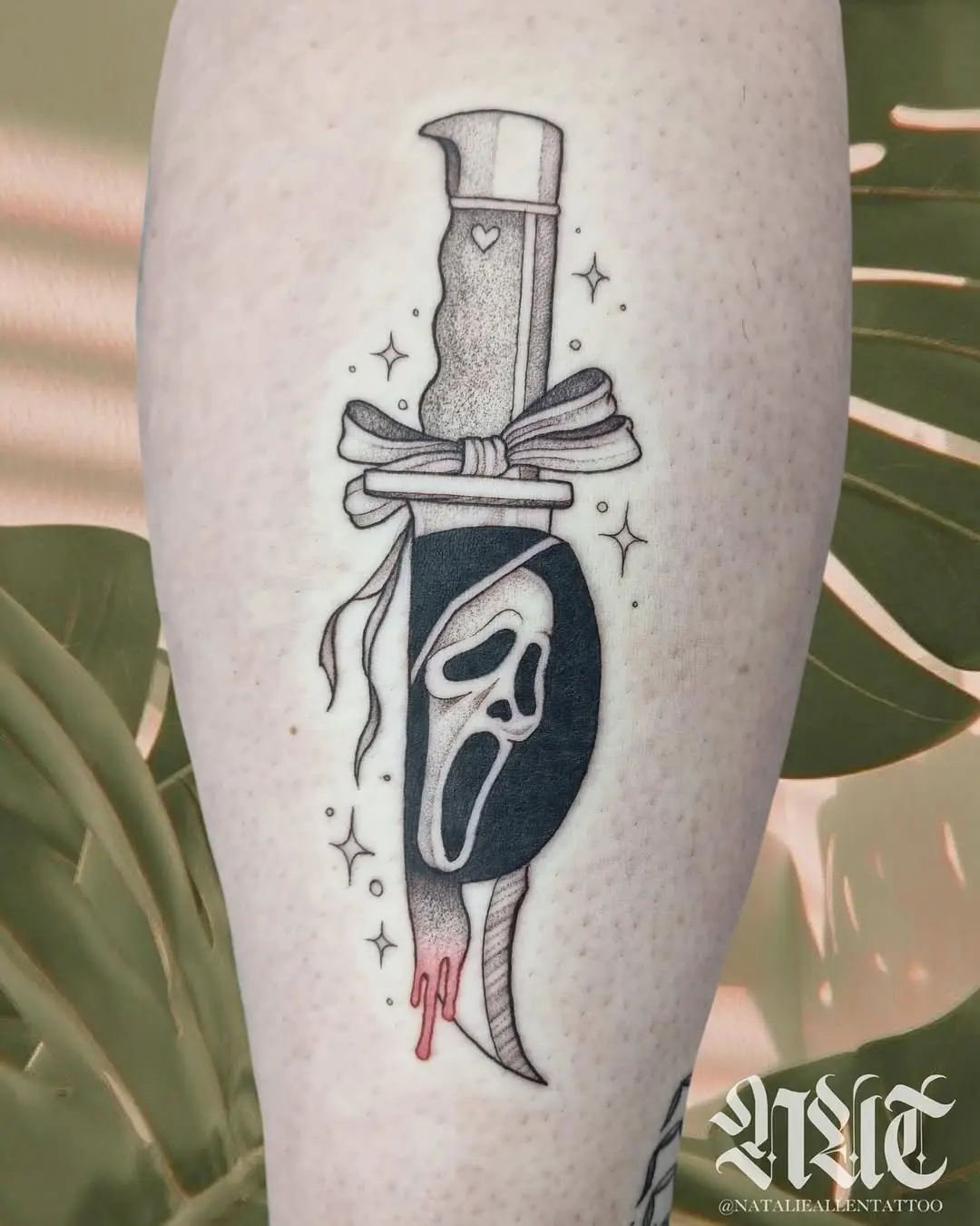 Intricate dagger tattoo with a dramatic flair