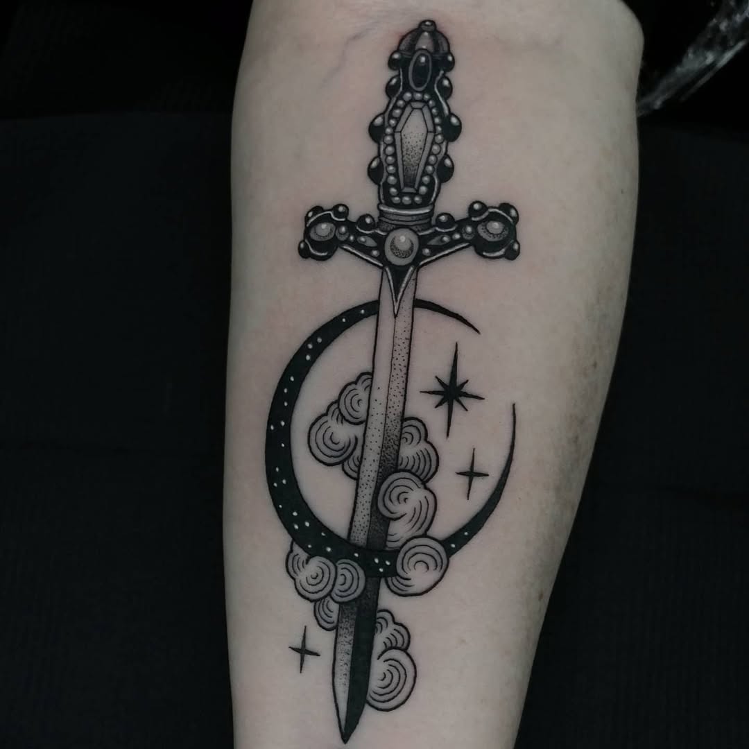 Elegant dagger tattoo with moon and clouds