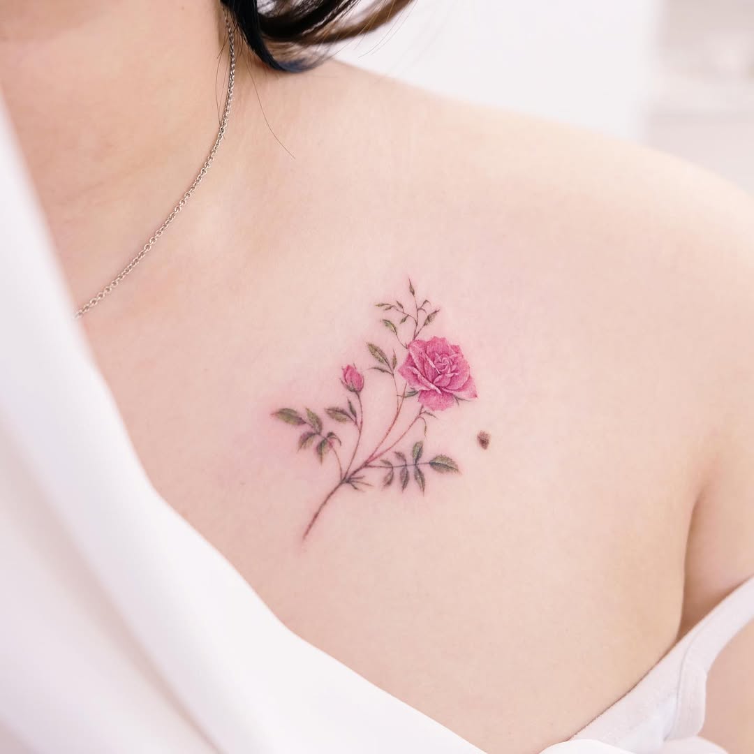 Charming pink rose tattoo on the chest