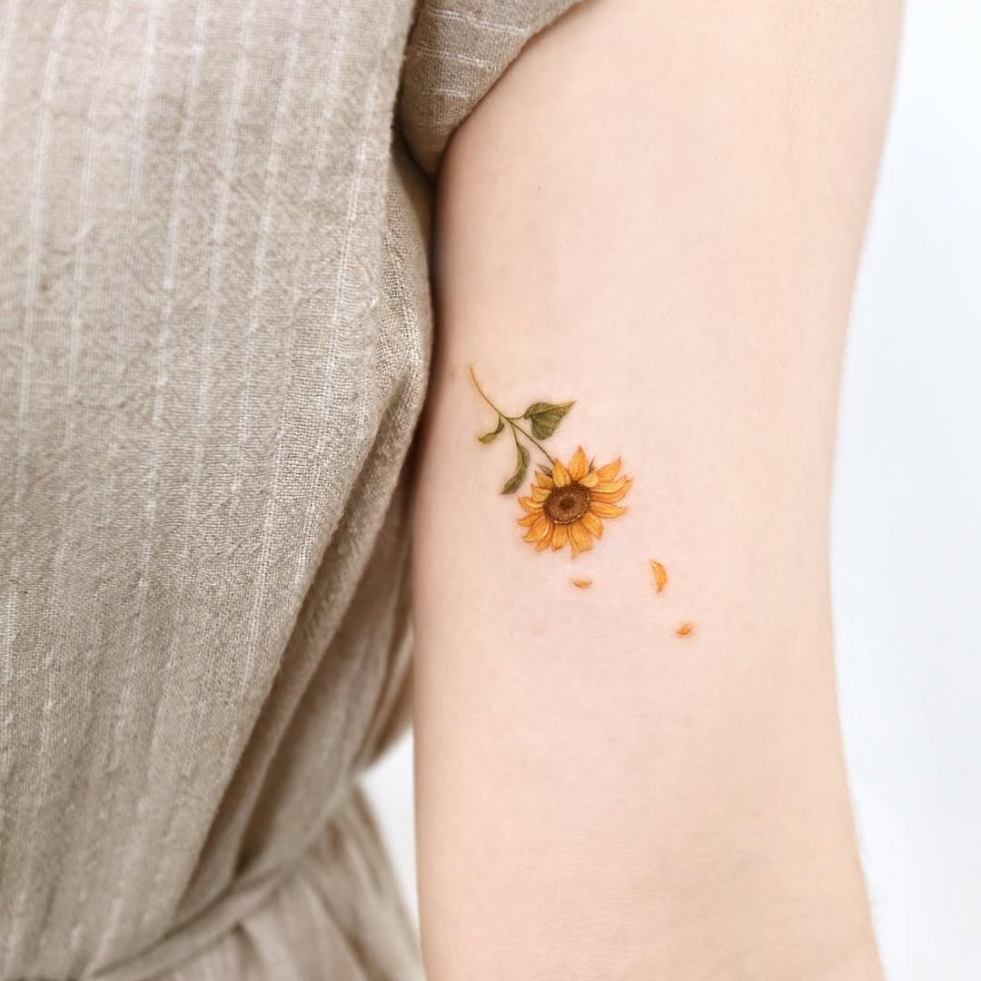 Charming sunflower tattoo capturing natural beauty