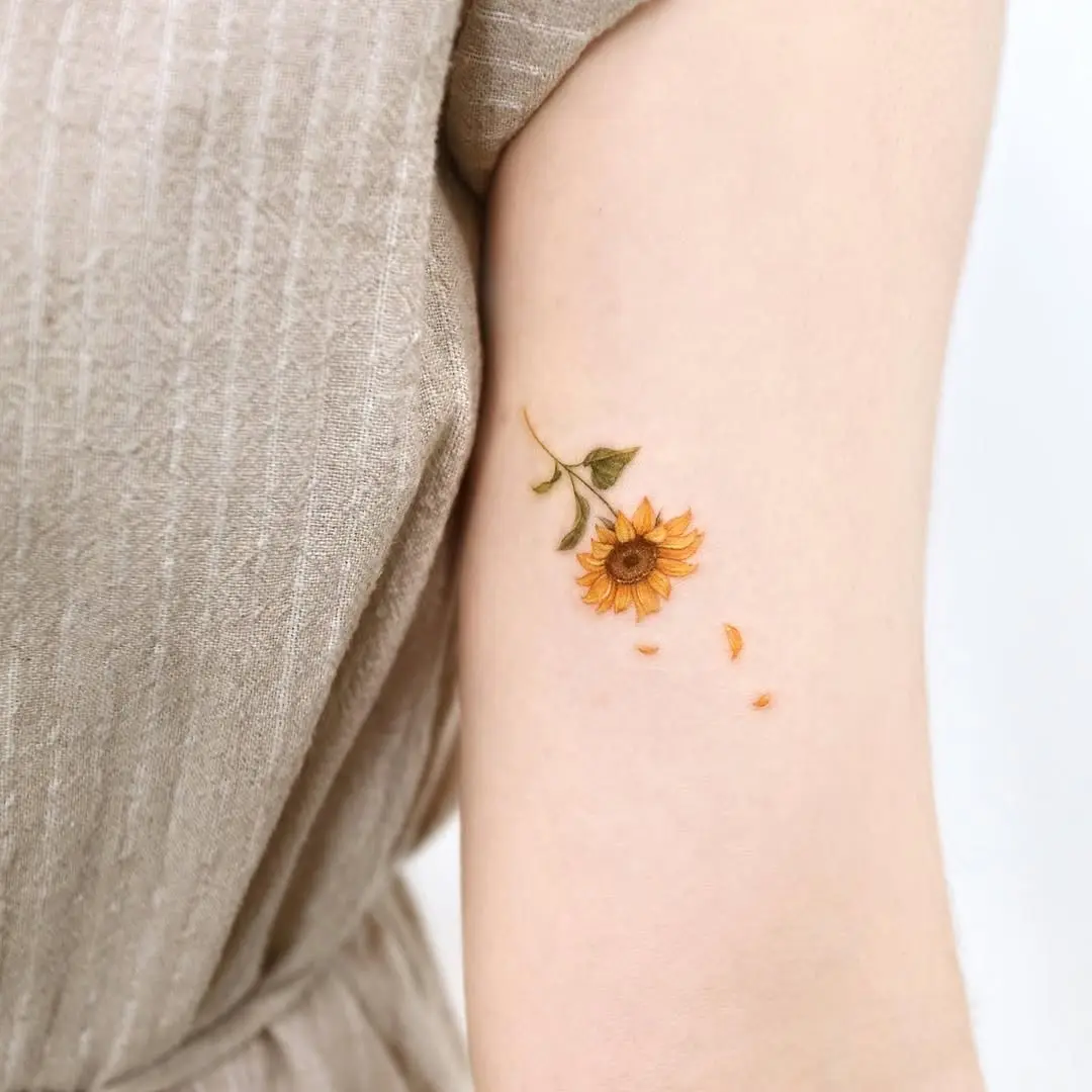 Charming sunflower tattoo capturing natural beauty