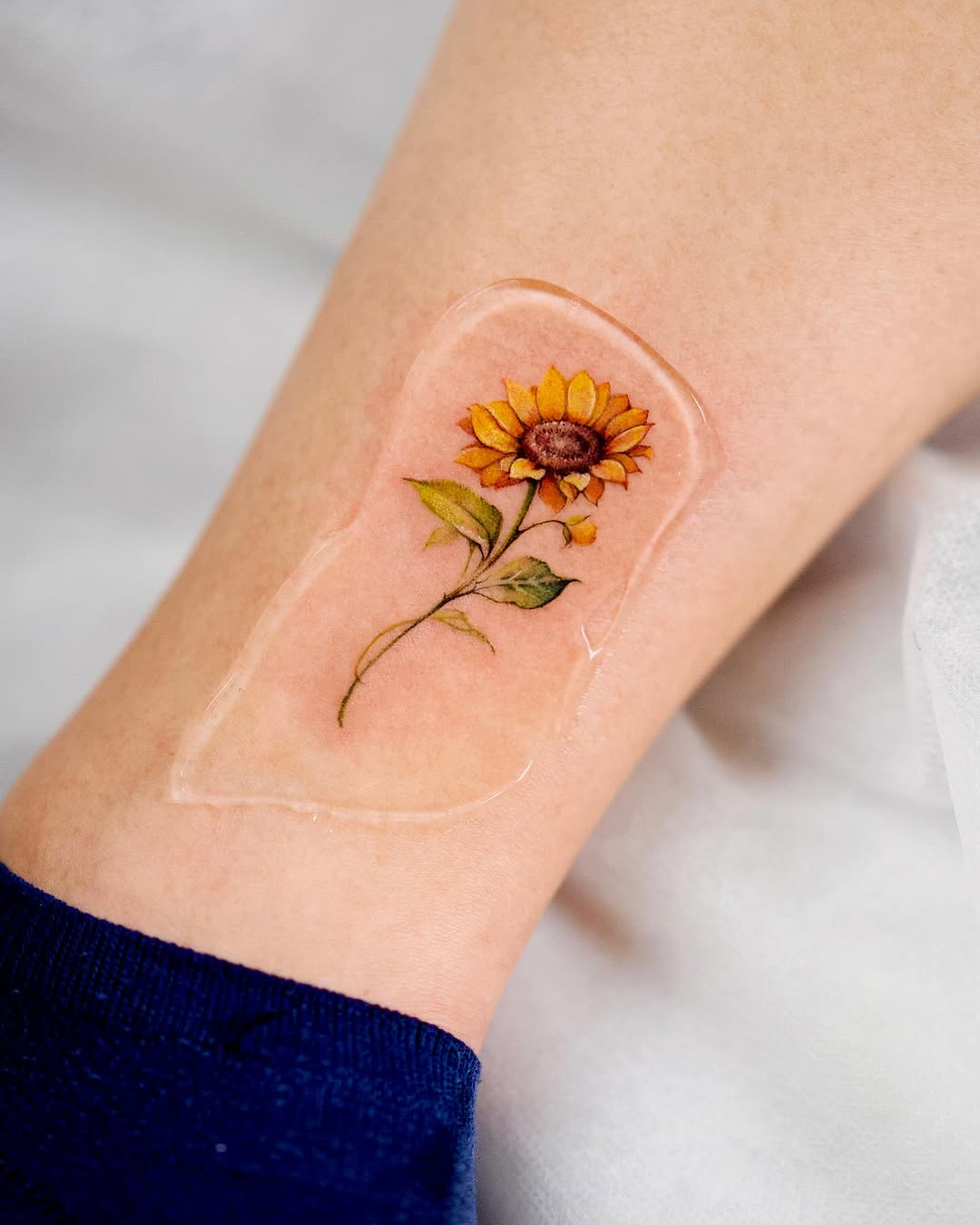 Charming sunflower tattoo with delicate details