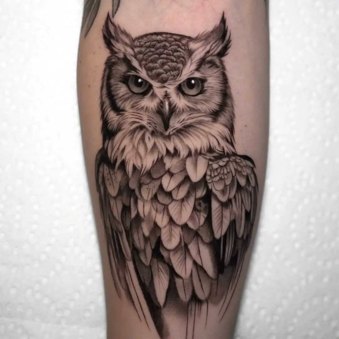 Elegant black and grey owl tattoo design