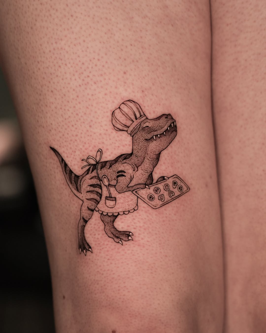 Whimsical dinosaur chef tattoo design inspiration