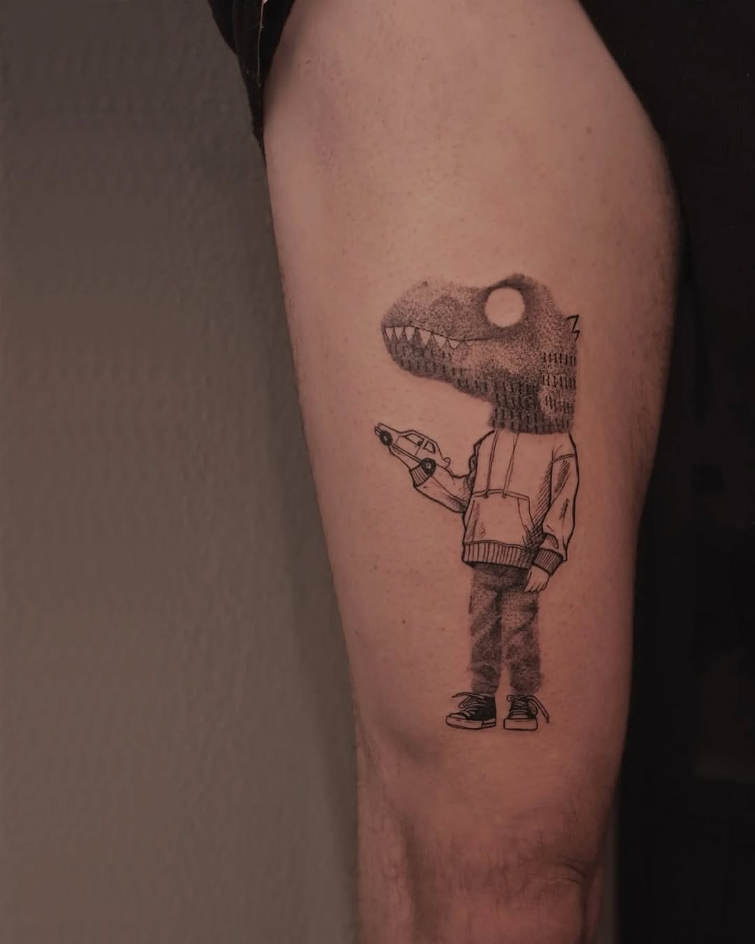 Whimsical dinosaur tattoo with urban flair