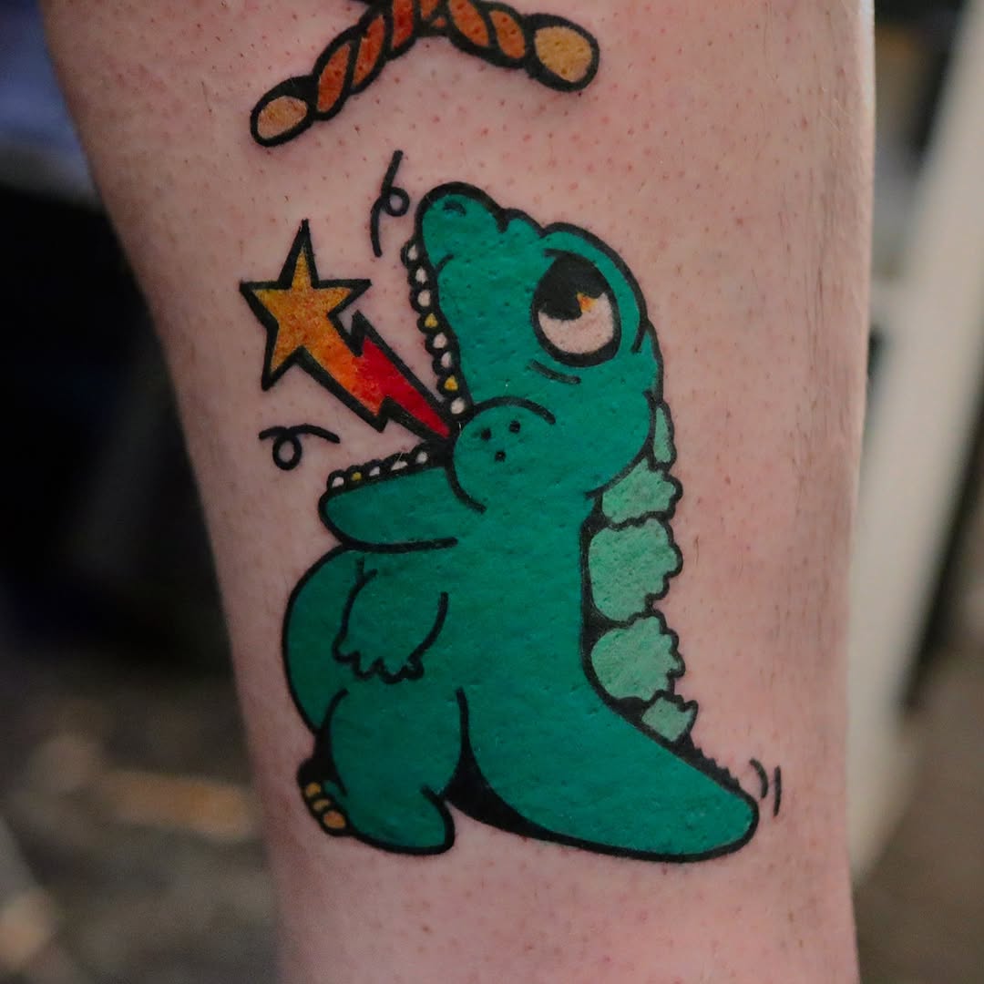 Whimsical dinosaur tattoo with cartoon flair