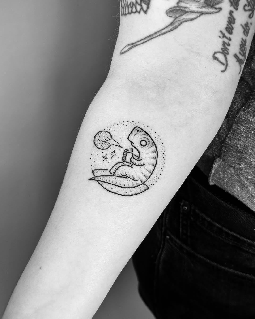 Dinosaur enjoying a cosmic adventure tattoo