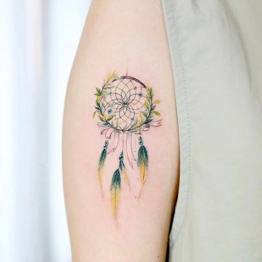 A vibrant dreamcatcher with delicate feathers.