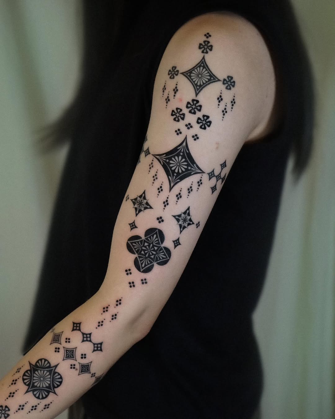 Elegant Black Geometric Sleeve Tattoos Design