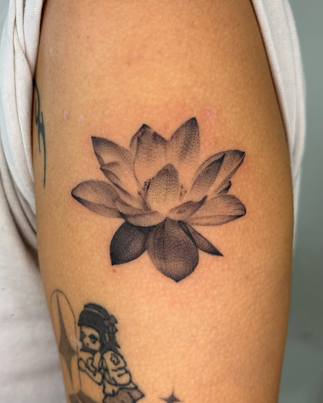 Stunning black and white lotus flower tattoo design