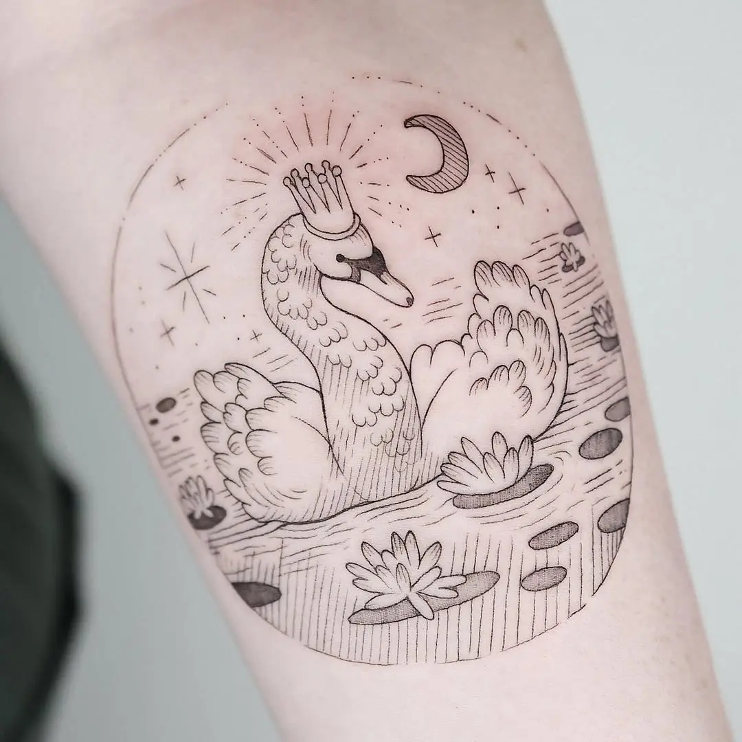 Regal swan tattoo surrounded by serene elements