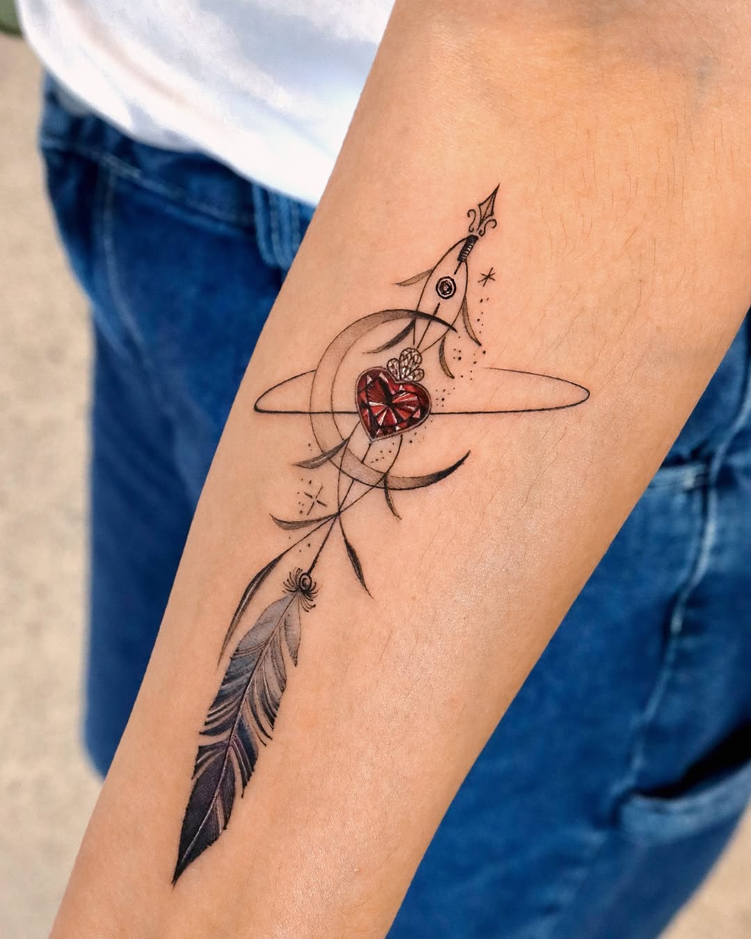 Unique feather and heart tattoo design